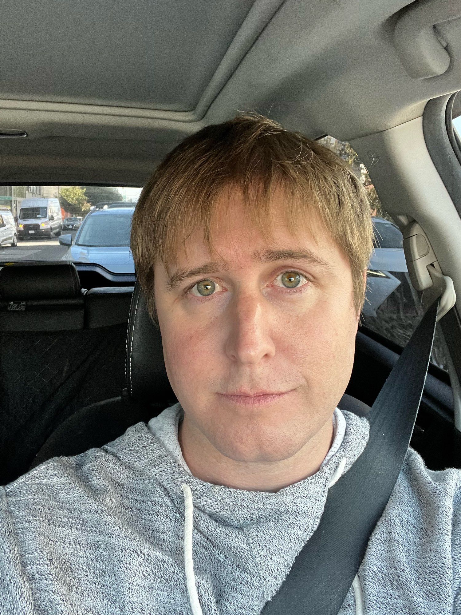 a white woman, looking very boyish and sad, sitting in the drivers seat of her car having just gotten her first HRT shot

she is happy but scared because she's not sure if she can do "this" (author's note: she could, in fact, do it)