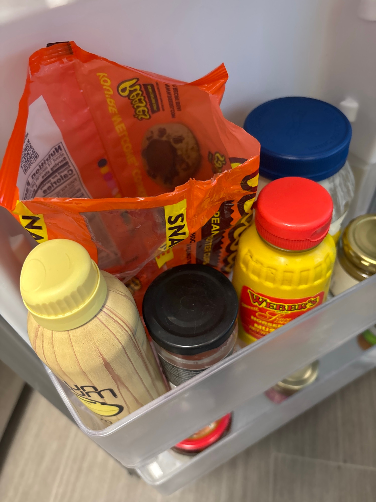 Reese’s in my fridge with other condiments and sunscreen
