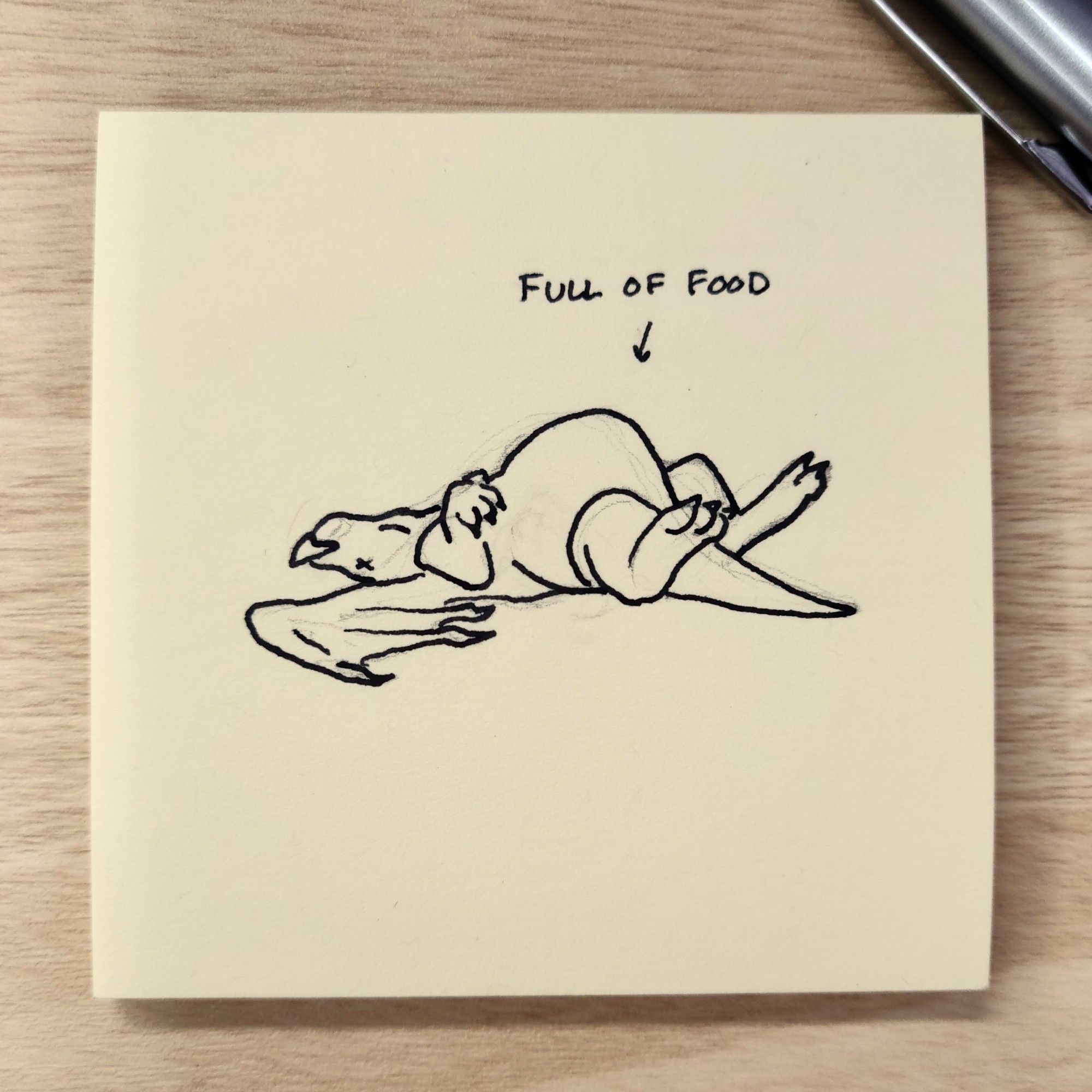 pen on post it drawing of a dragon lying on his back, with a big stomach. text says "full of food" with an arrow to him.