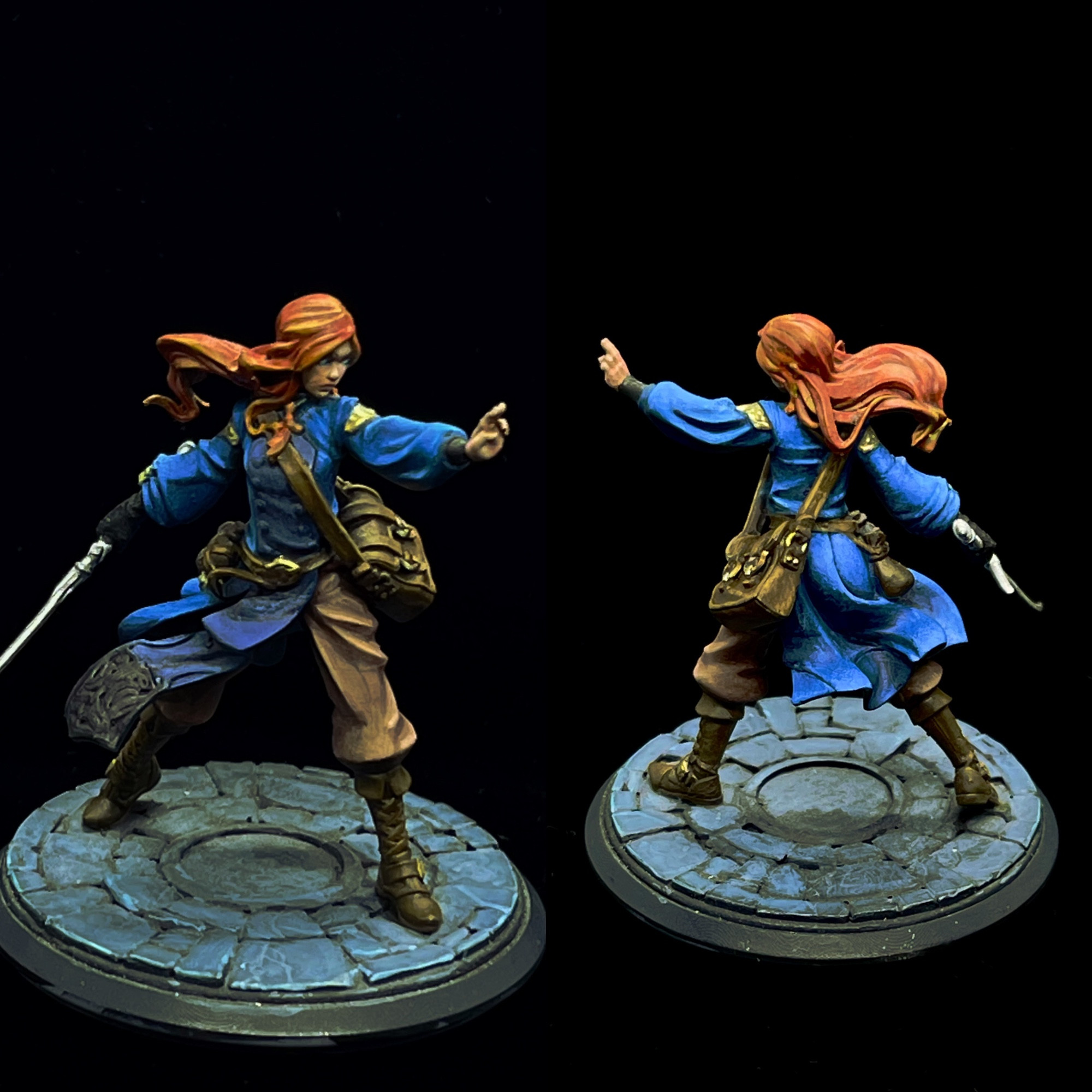 Shallan Davar from The Stormlight Archives by Brandon Sanderson. She’s wearing a blue blouse with a navy tabard, khaki pants with brown boots, and a long silver sword in her gloved right hand. She has flowing red hair and holds her left hand extended in front of her, palm outward in a warding pose