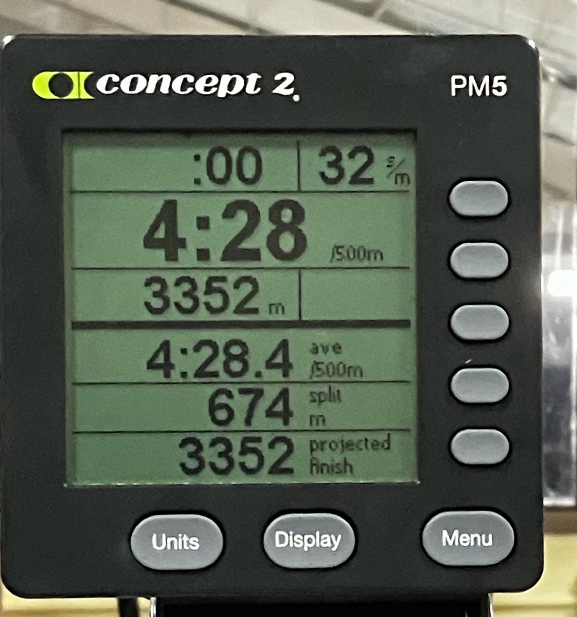 The console from a Concept2 rowing machine showing workout stats.