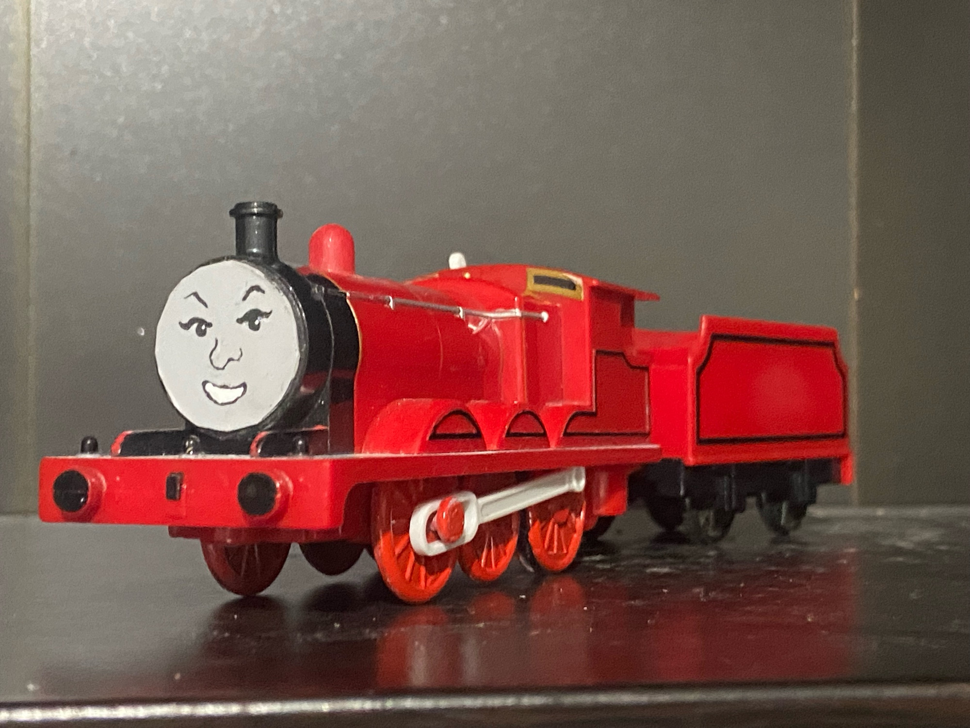 The Red Engine. Not James, but it’s literally just James with the number and gold dome sanded down to just be red, the wheels are painted red.