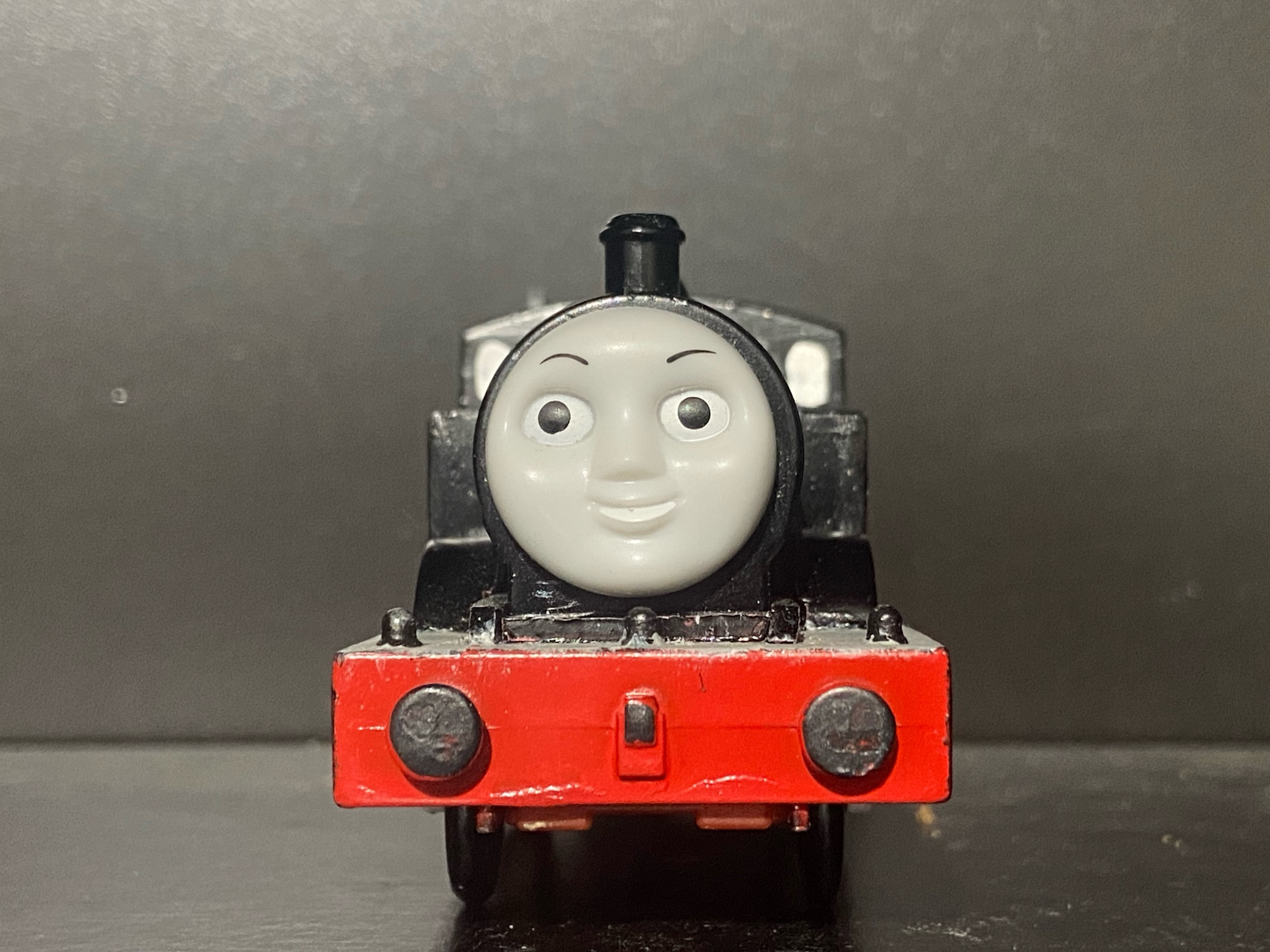 Jinty, from The Railway Series book “The Eight Famous Engines” with some slight alterations.

She is still painted Black. Her face is Emily’s face straight up, no changes it’s literally just Emily’s face.