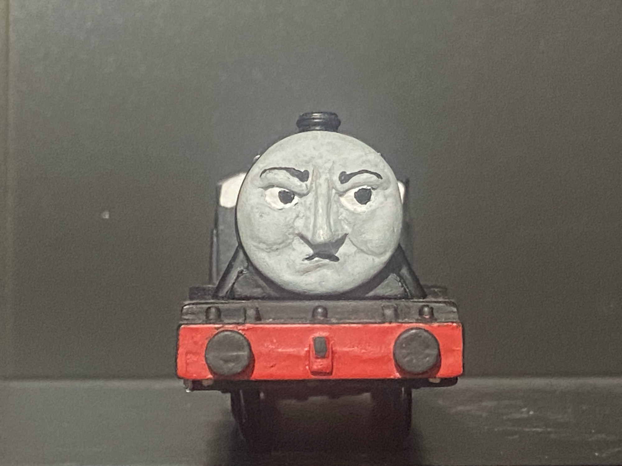 Dudley the Vagrant Engine, a character created by the buried truck as a TrackMaster toy.

He is angry and is looking to the right side of the photo, this face is based off one by jje09 over on Twitter, which was used on the model in Carson’s Video Workshop’s adaptation of the Dudley Stories.