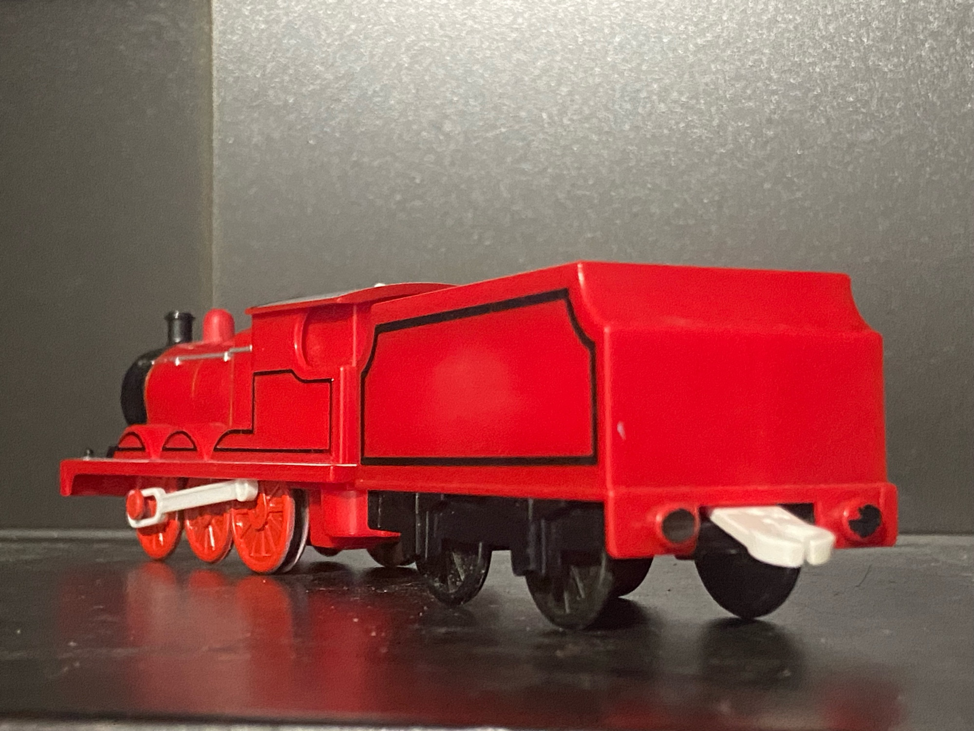 The Red Engine. Not James, but it’s literally just James with the number and gold dome sanded down to just be red, the wheels are painted red.