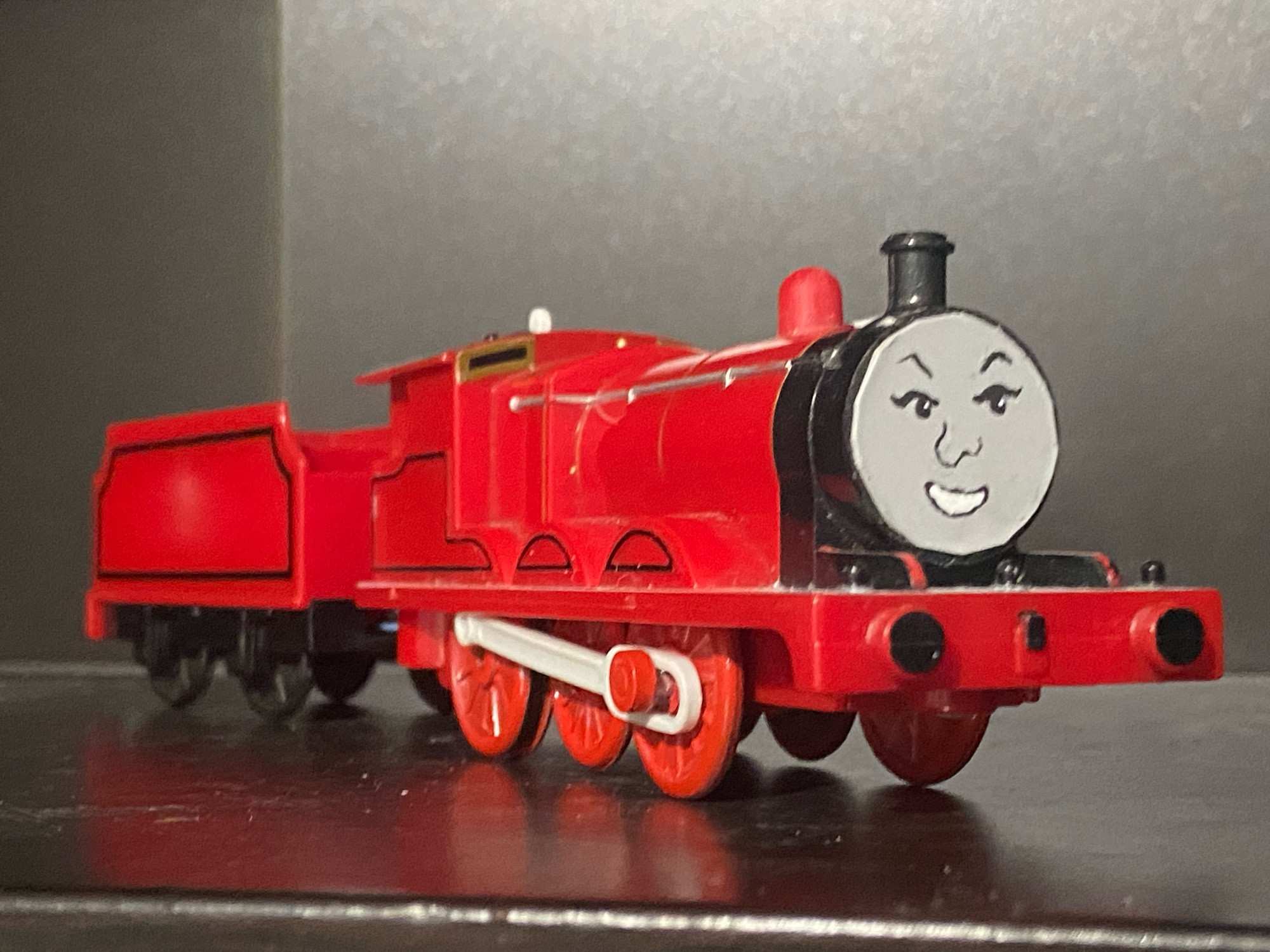 The Red Engine. Not James, but it’s literally just James with the number and gold dome sanded down to just be red, the wheels are painted red.