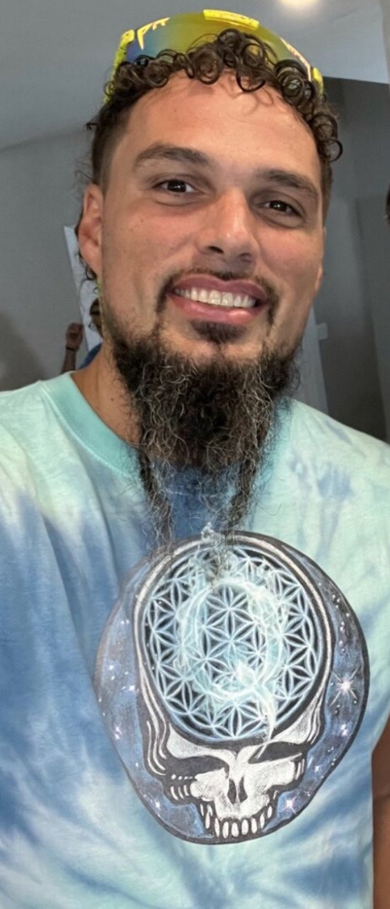 Photo of Vivas wearing a QAnon shirt.