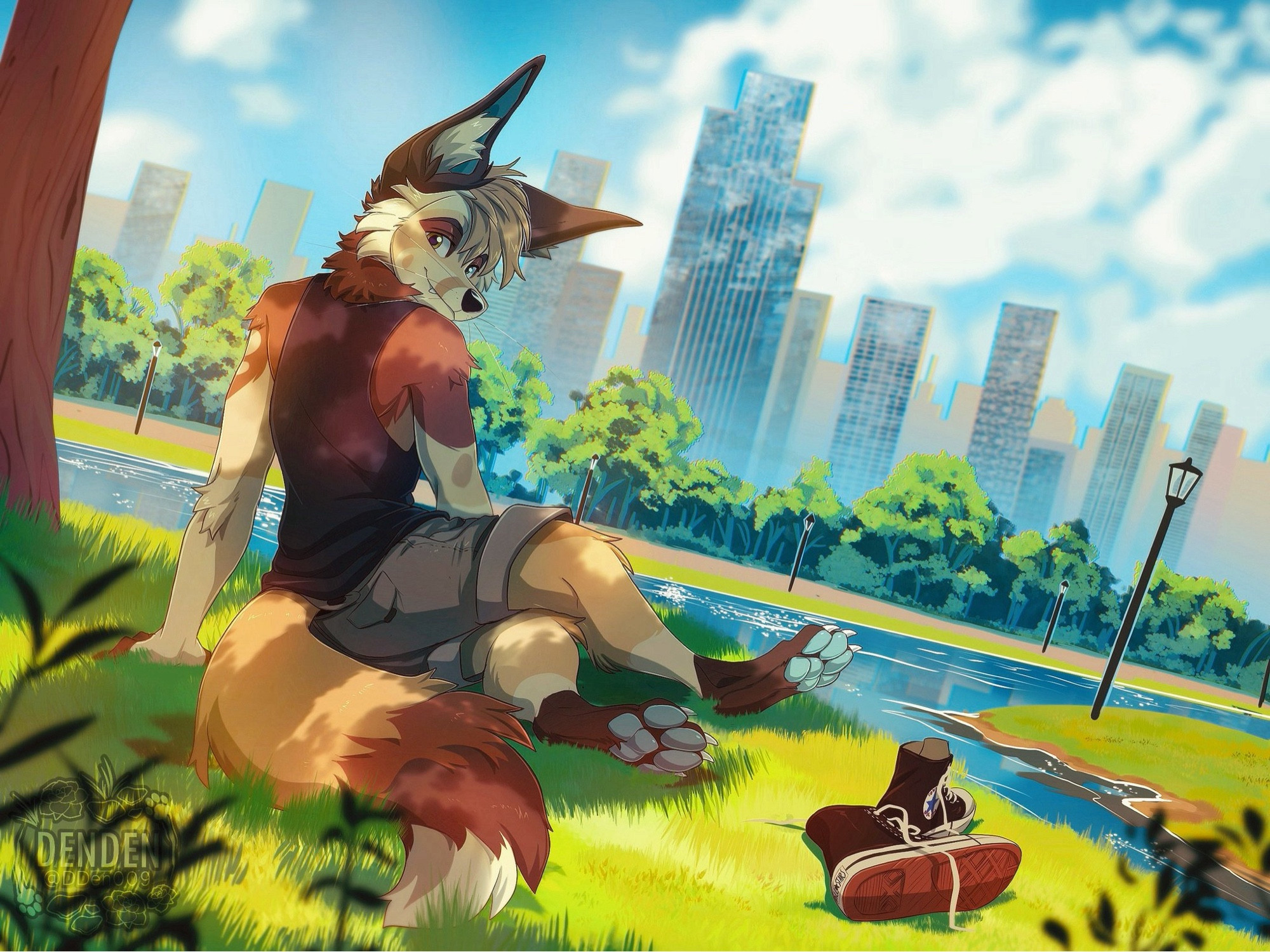 Riko sitting in the center of a park within a city, looking back at the viewer with his shoes off and his beans showing.