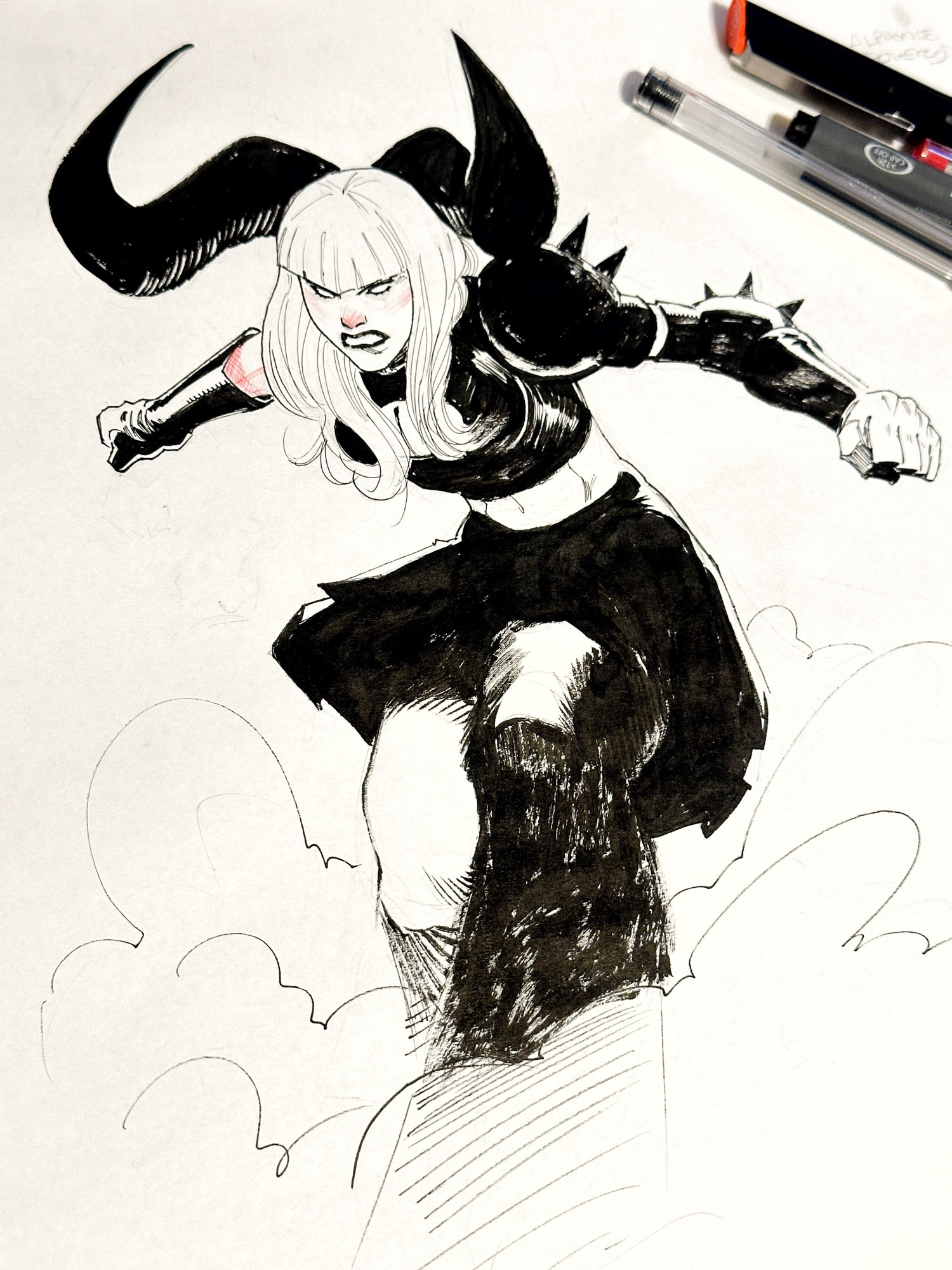 Magik looking mean like maybe she landed in a cloud of smoke or something.