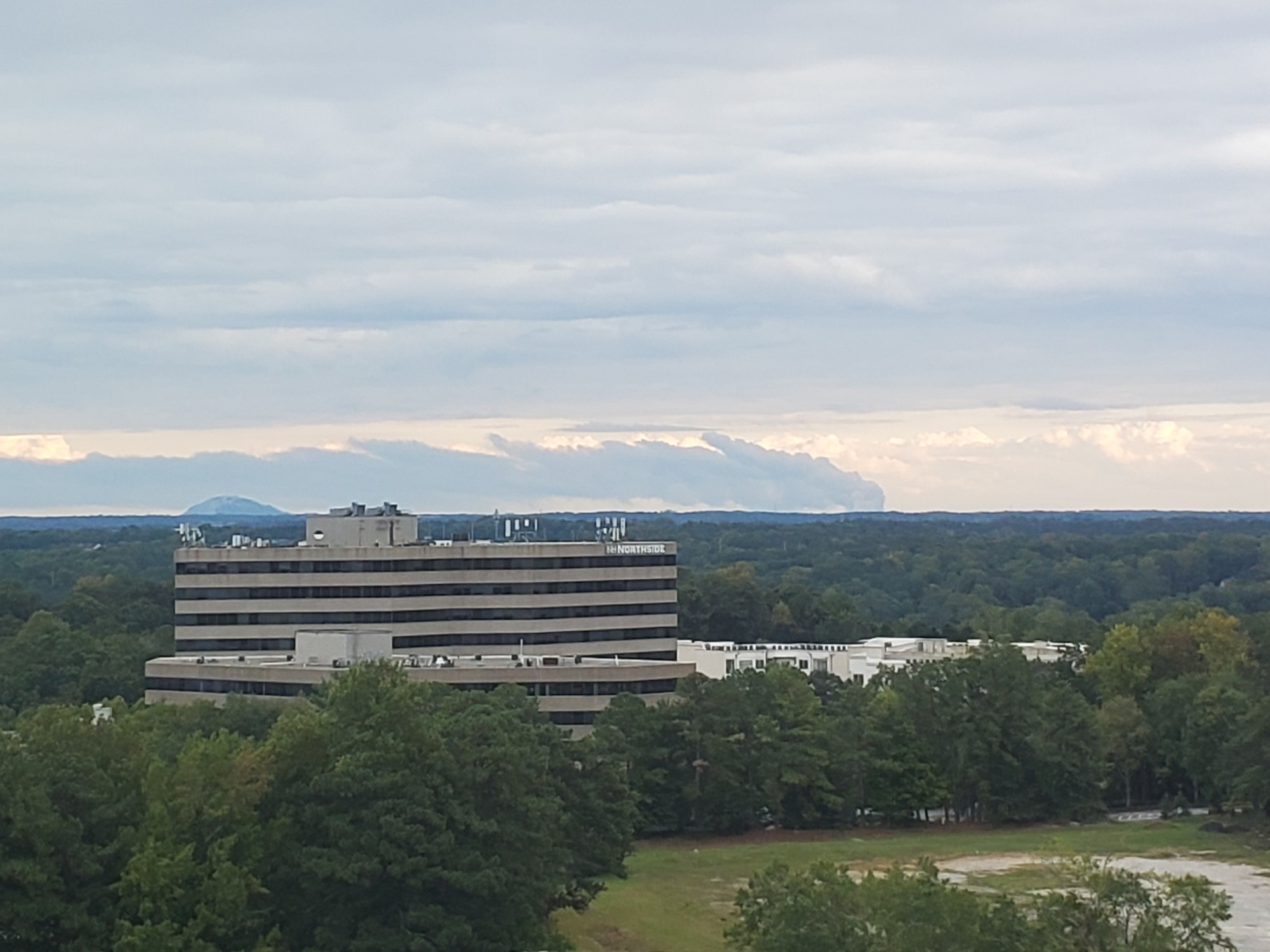 A picture from northeast Atlanta showing the plume of smoke from a fucking chemical lab fire in Conyers. Oh, and Stine Mountain