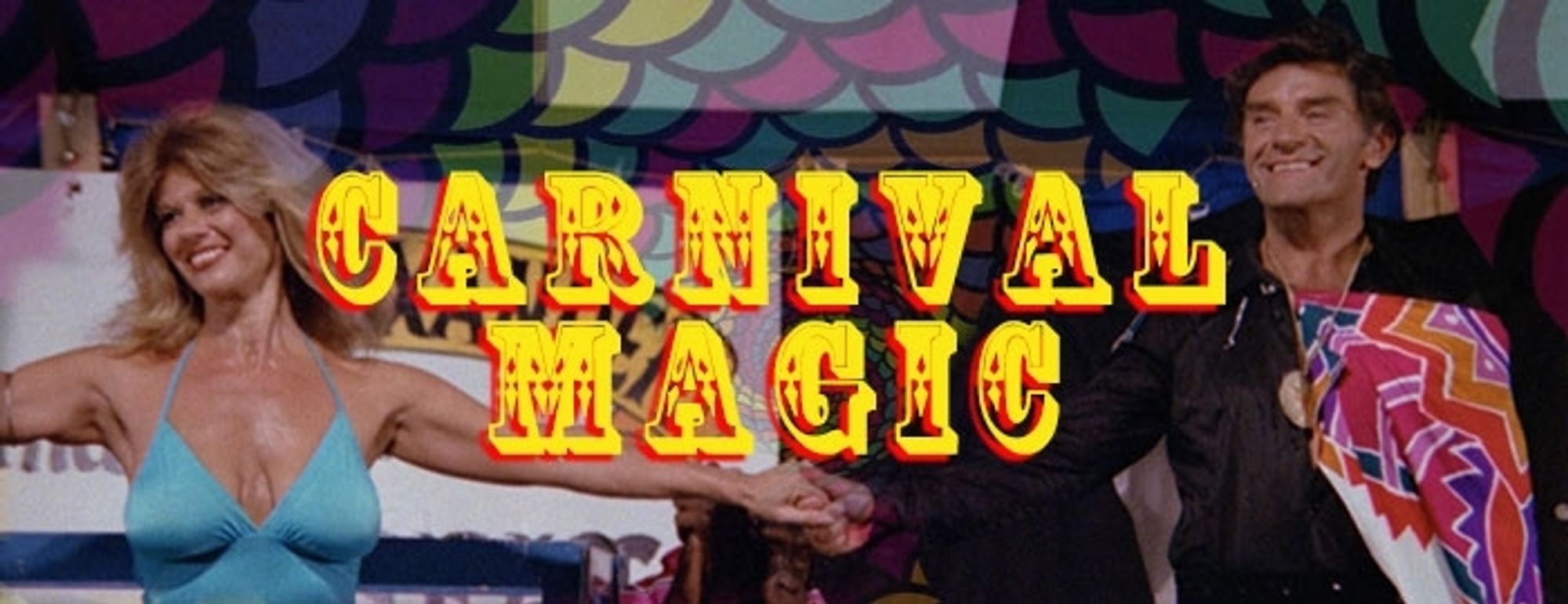 A title card for the film featuring a magician (Don Stewart) and his assistant (Regina Carrol) on stage