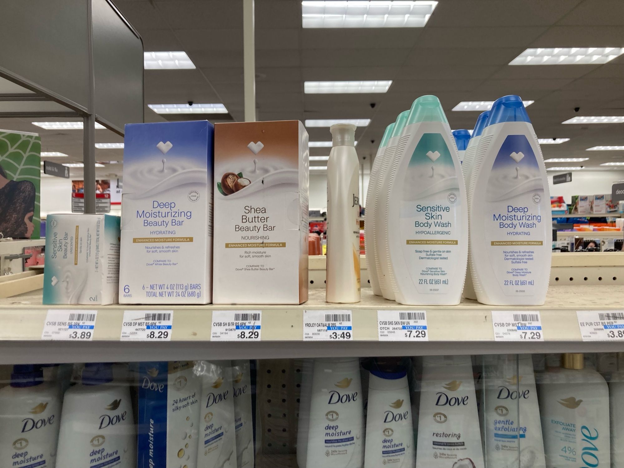 CVS store brand soap products sitting on top of a case where the rest of the soap for sale is locked up.