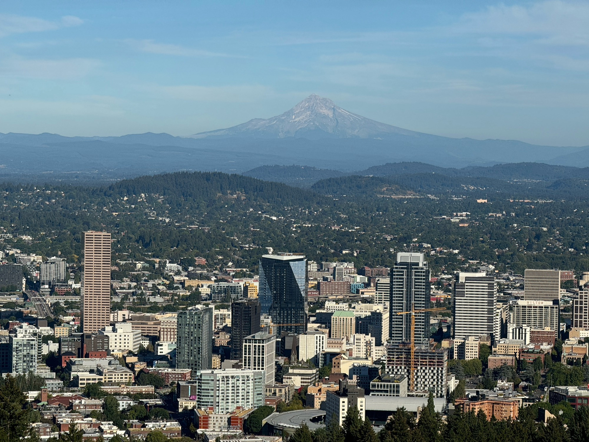 Mt. Hood with nearly no snow cap in the background. Downtown Portland in the foreground. View from Pittock Mansion.