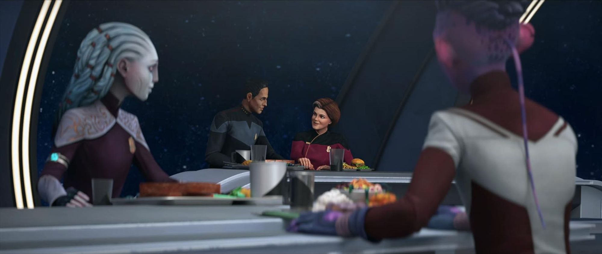 Screencap from Star Trek: Prodigy: Gwyn and Dal are looking behind them at Janeway and Chakotay, who are sharing a meal. Janeway's food consists of a hamburger and fries. Incidentally, they are also holding hands. 