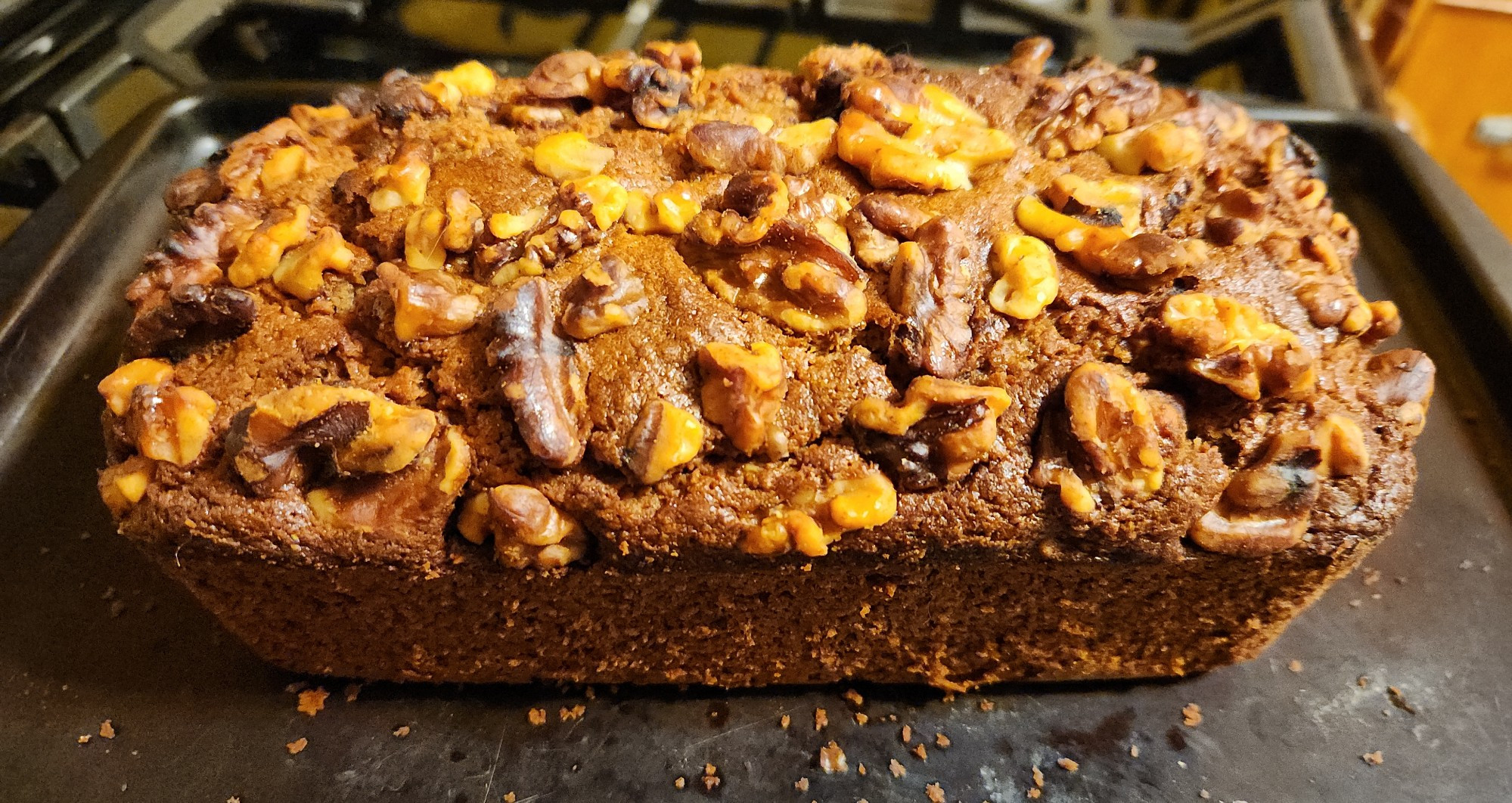 An apple banana bread loaf, with walnuts 