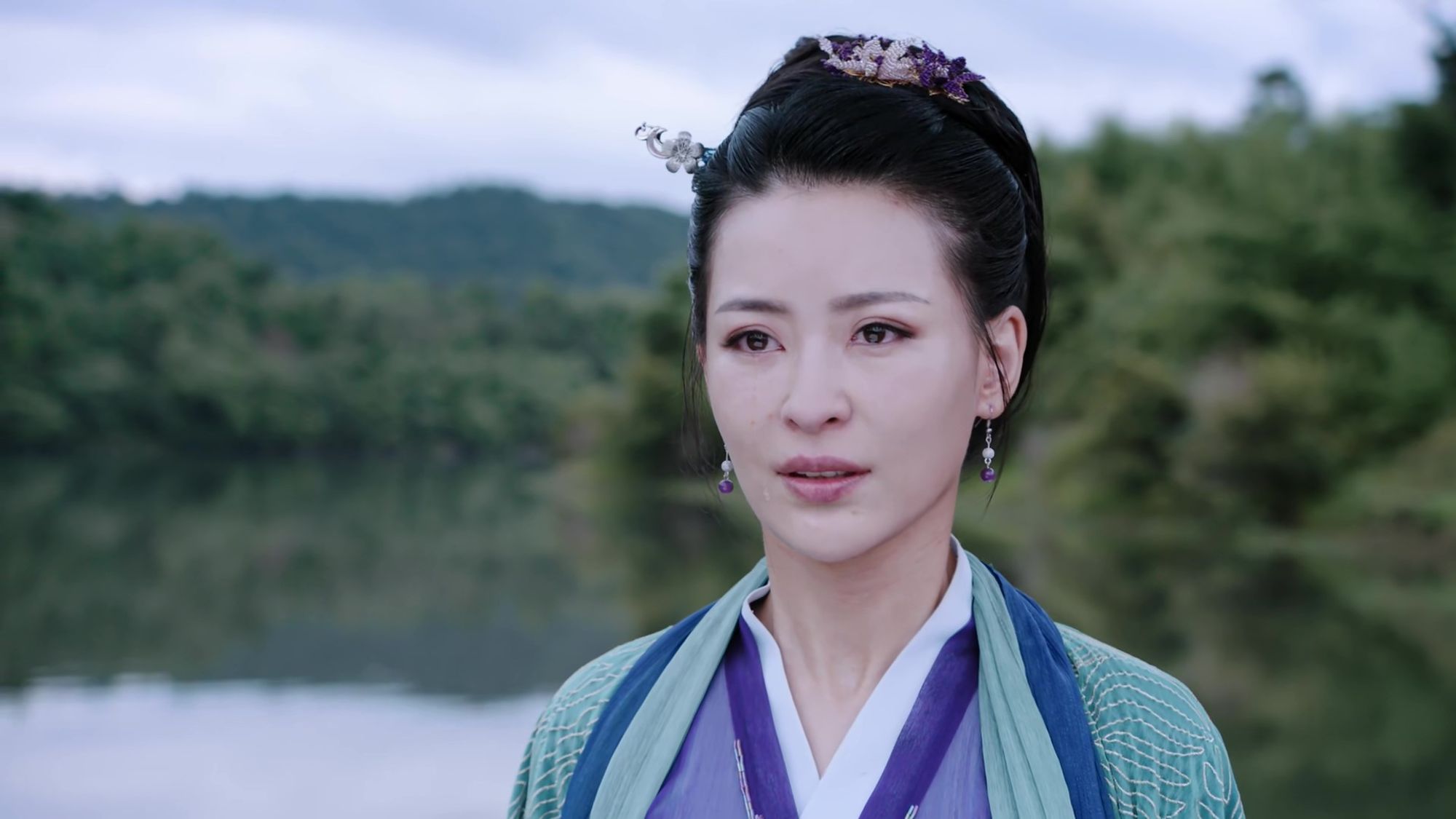 Yu Ziyuan from The Untamed in episode 15, looking perfectly put together  put deeply shaken, pale and wan and close to tears. Her face might be beginning to show bruises from her earlier fight