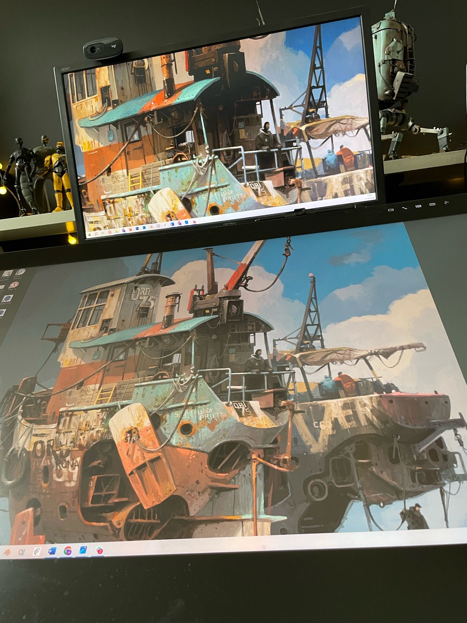 View of monitor screens displaying the cover artwork for Mileships by McQue/Rossignol.