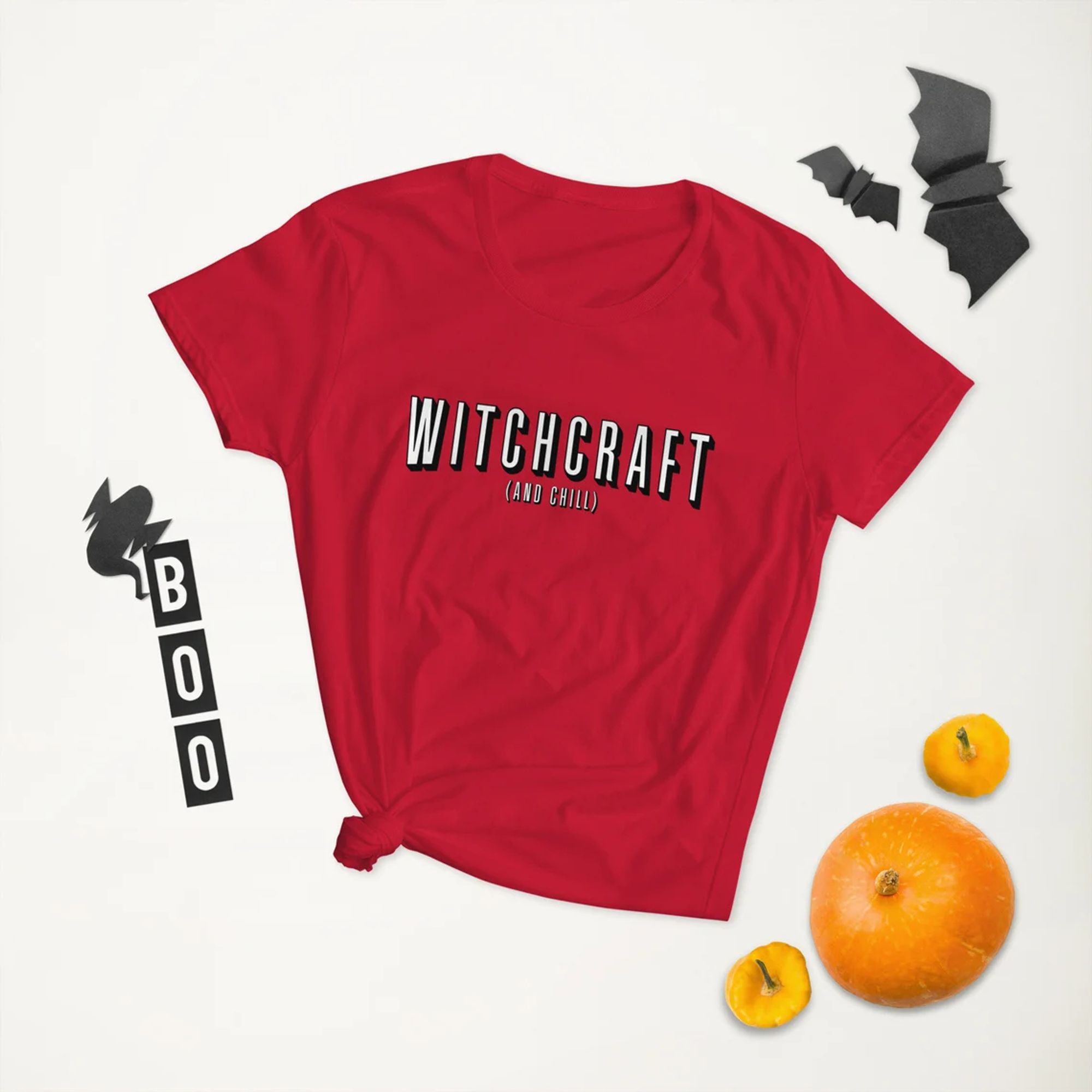 A red t-shirt with a parody of the Netflix logo that says "Witchcraft and Chill"