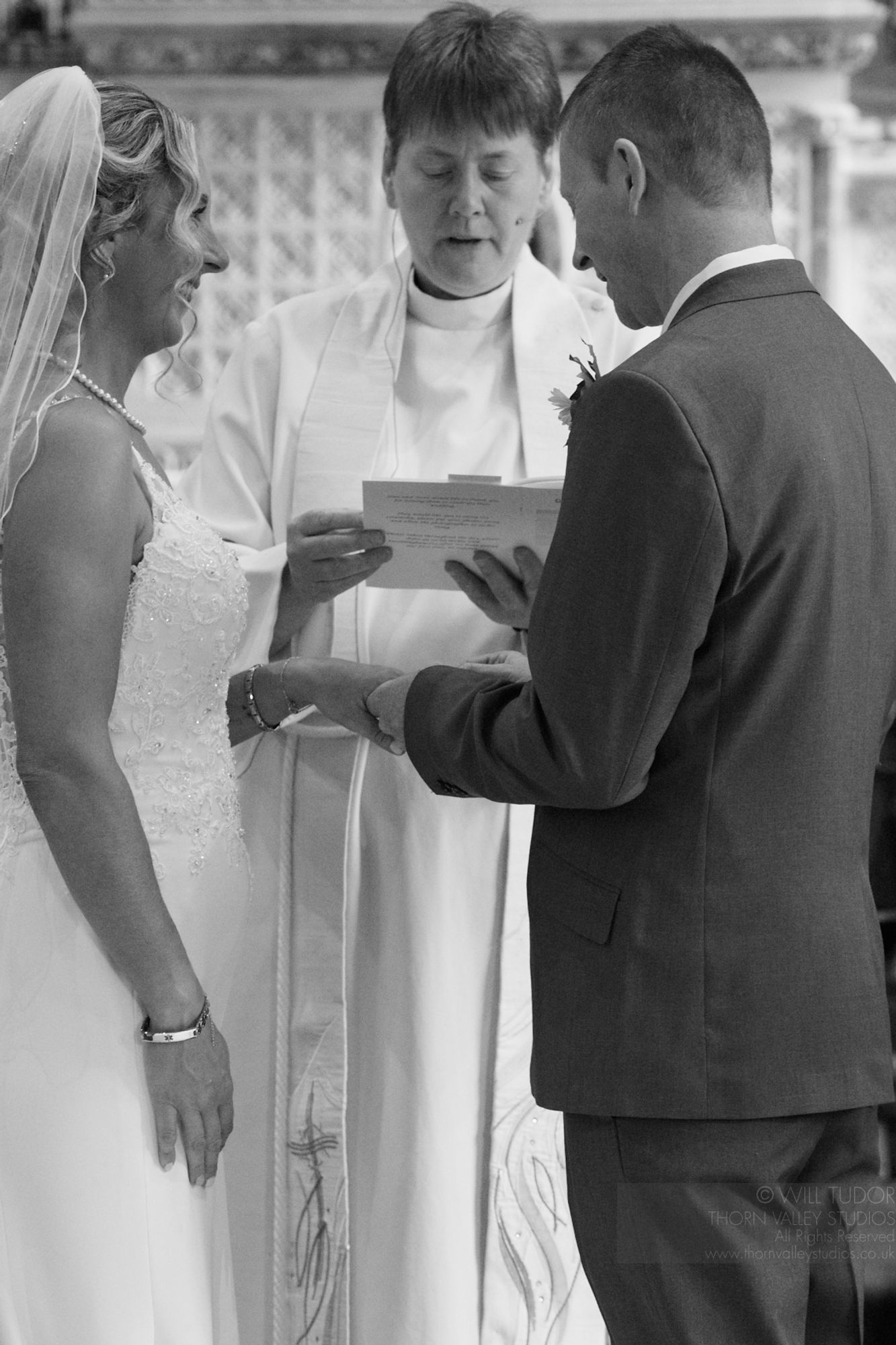 Bride & Groom exchanging rings