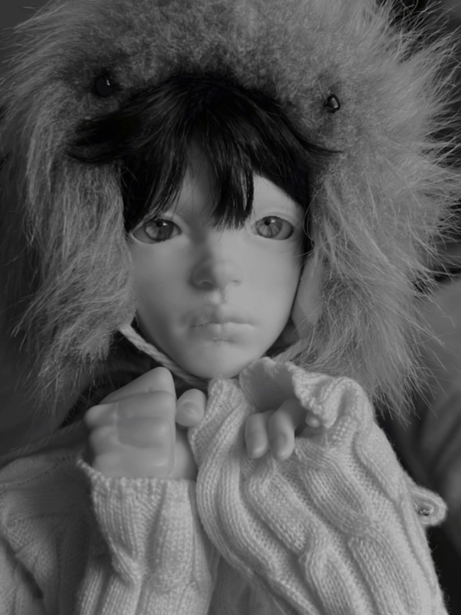 Black and white headshot of bjd with arms up under chin!