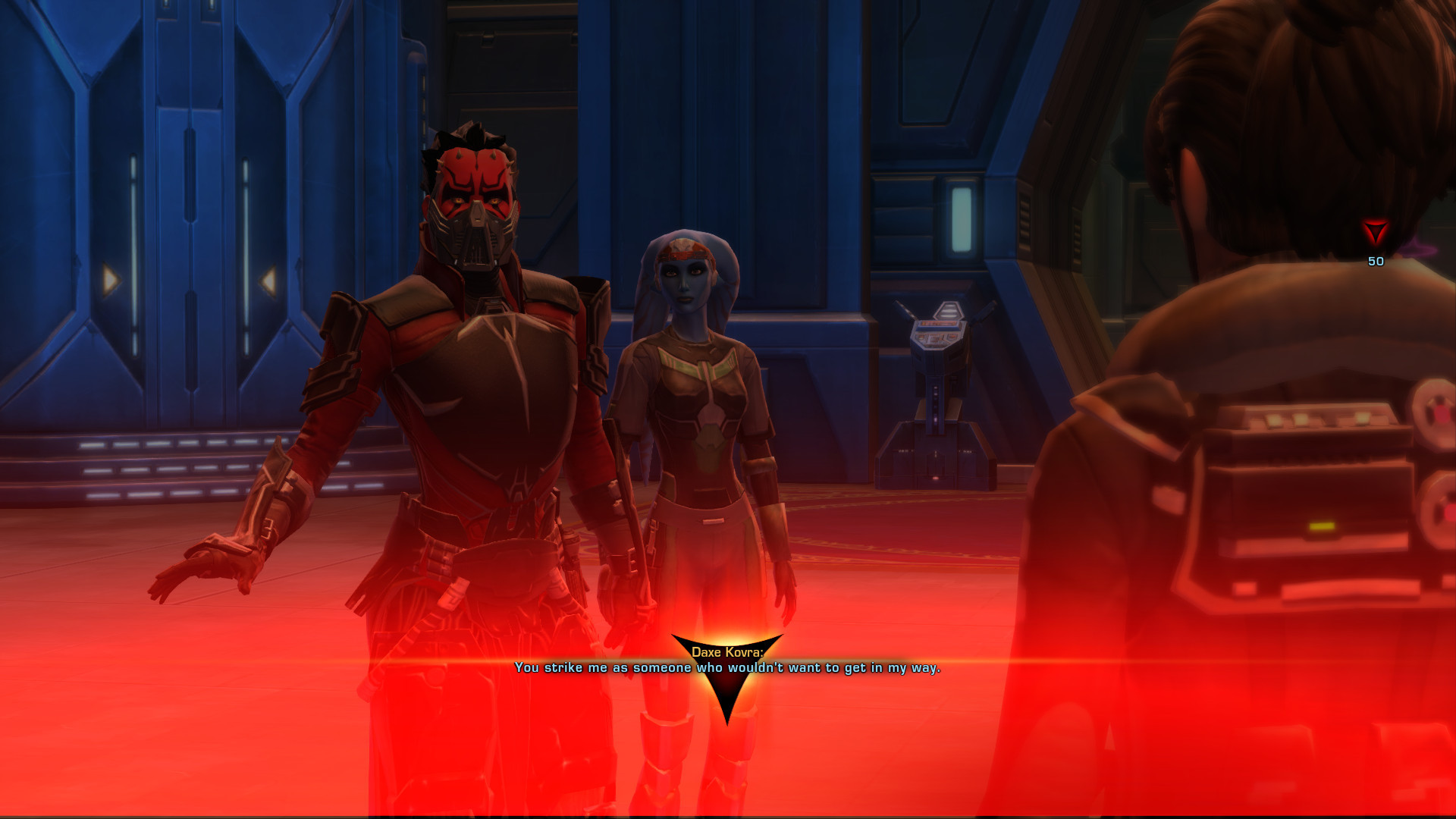 Screenshot from Star Wars: The Old Republic of a red female Zabrak character in sleek black and red armor berating an npc. She wears a menacing mask and is accompanied by Vette, a blue twi'lek companion. There is a red gradient over the screen from the player choosing a Dark Side dialogue option. The Zabrak Sith Warrior is saying "You strike me as someone who wouldn't want to get in my way."