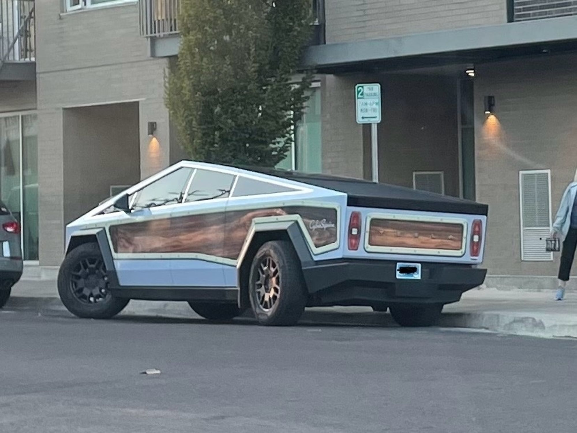 a cybertruck tricked out to look like an old woody wagon