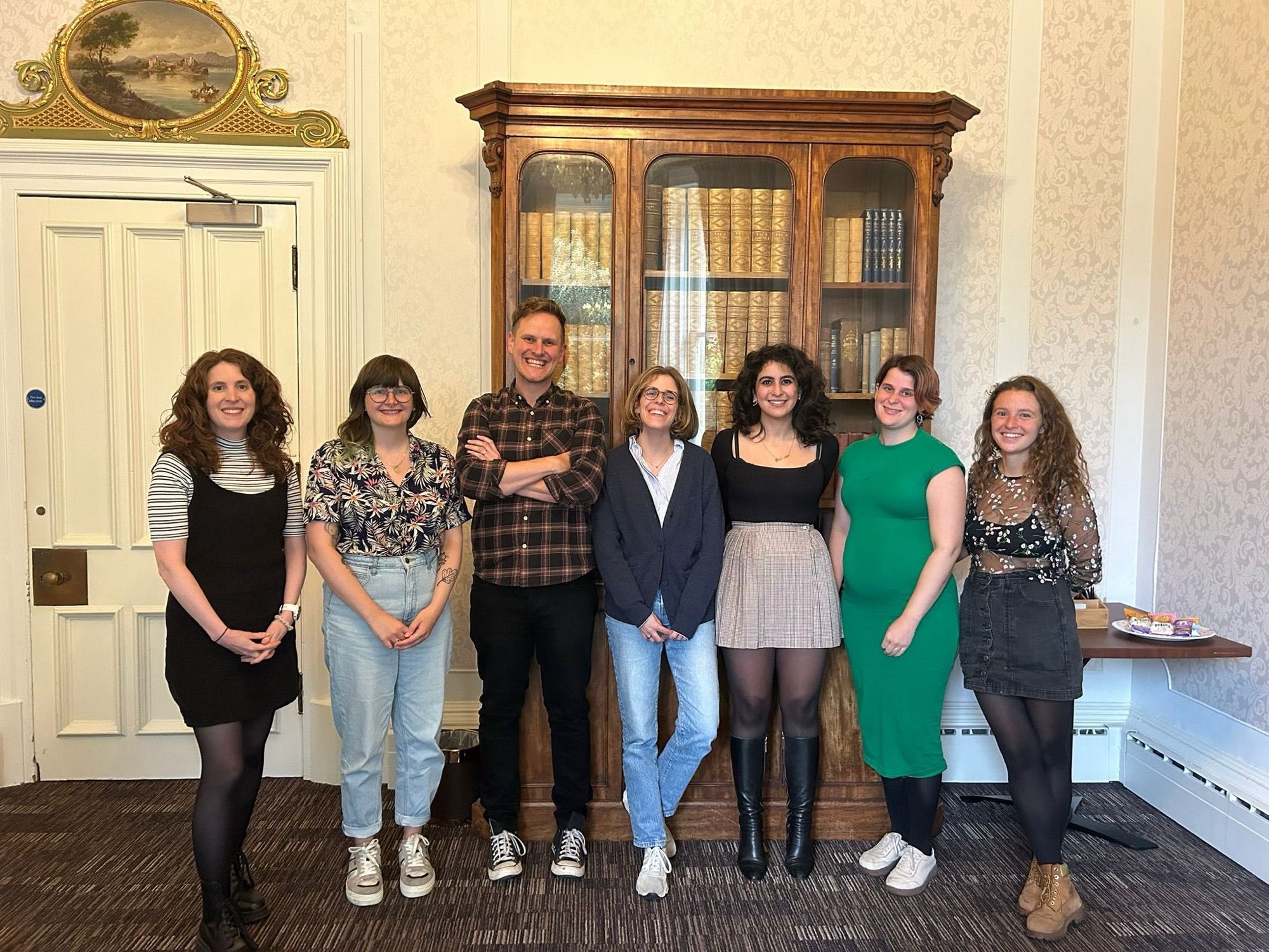 Fae Garland, Zoe Tongue, me, Mireia Garces De Marcilla Muste, Zaina Mahmoud, Ruby Reed-Berendt and Anna Nelson hanging out by a pretty spiffy book case in Reed Hall in Exeter