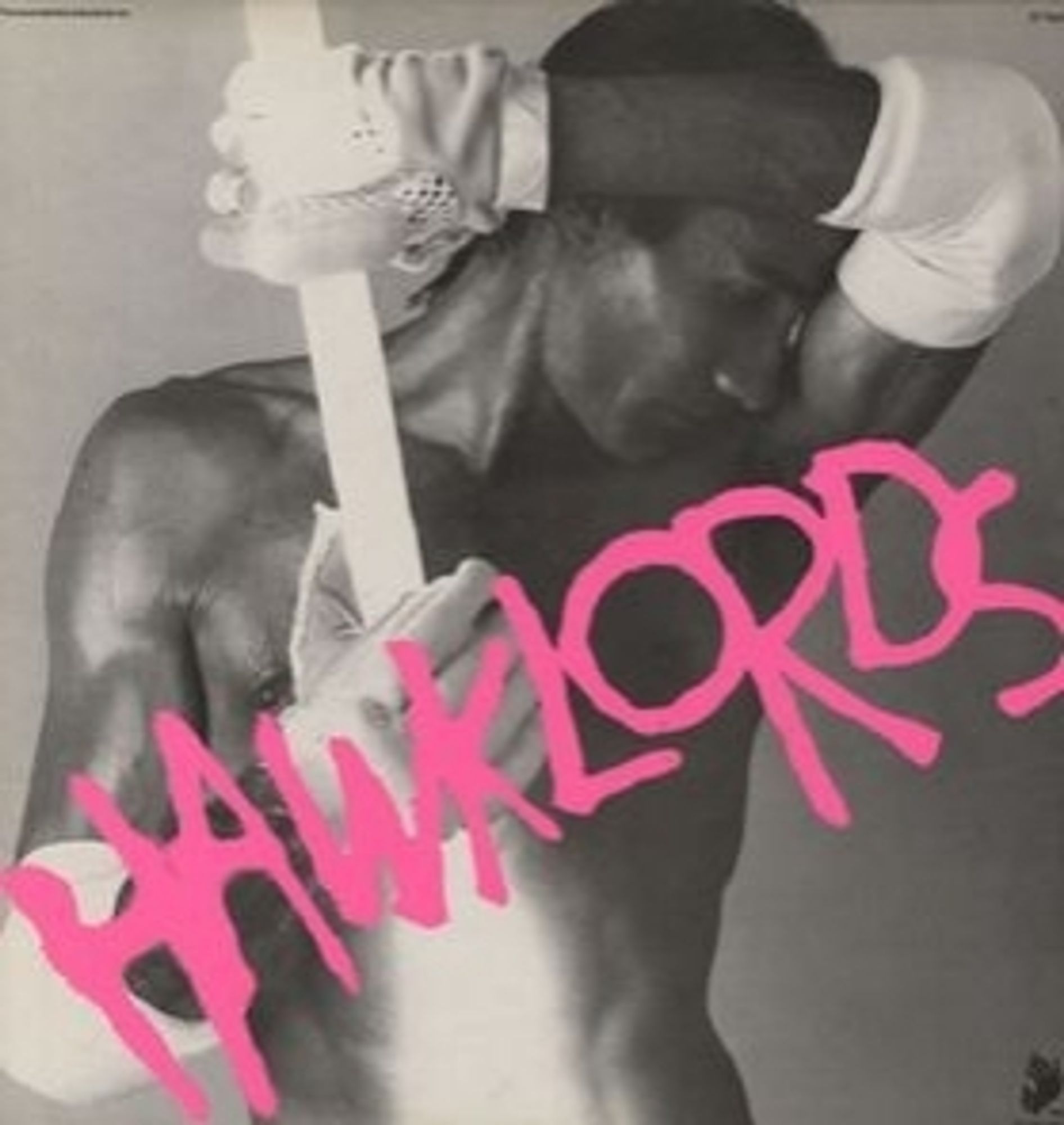 Album now titled 25 Years On by Hawkwind performing as Hawklords. Image of a shirtless silver dude in white gloves & elbow socks, holding a glowing rod. HAWKLORDS in neon pink.