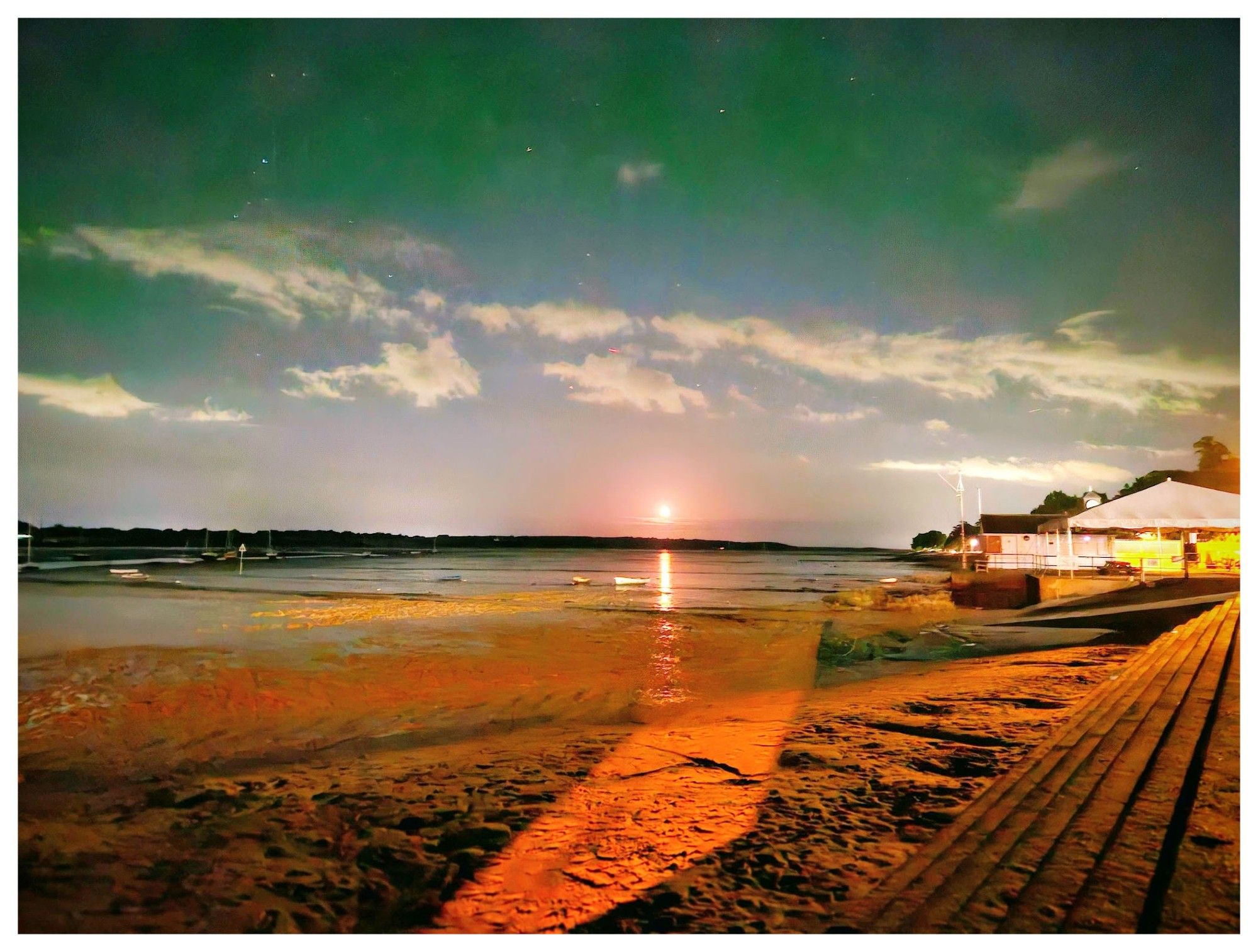 The moon rising over the River Stour at Manningtree in Essex. Long exposure phone camera shot by me.