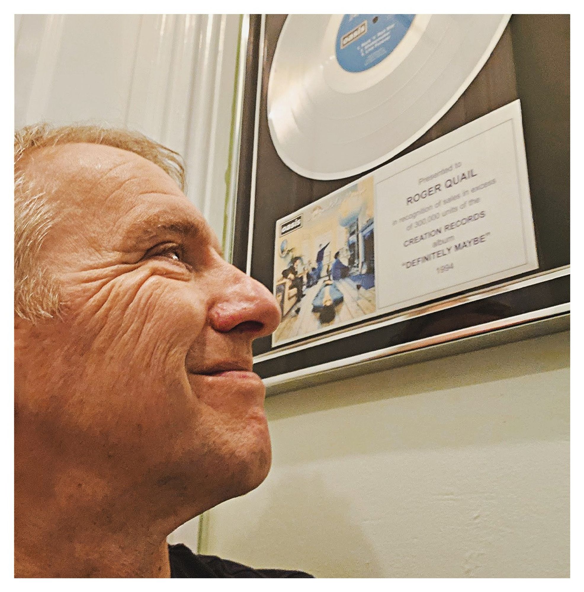 Me with my platinum disc award for 'Definitely Maybe' by Oasis, released on this day in 1994.