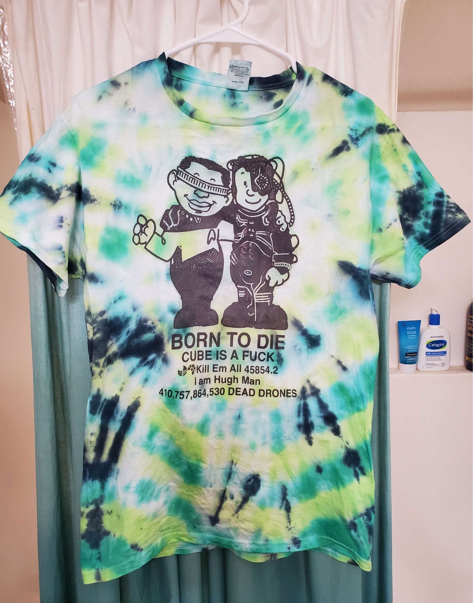 a green tie die shirt referencing the “BORN TO DIE WORLD IS A FUCK” cat and dog translation tee but with hugh and geordi where the text reads “BORN TO DIE, CUBE IS A FUCK, KILL EM ALL 45854.2, I AM HUGH MAN, 410,757,864,530 DEAD DRONES