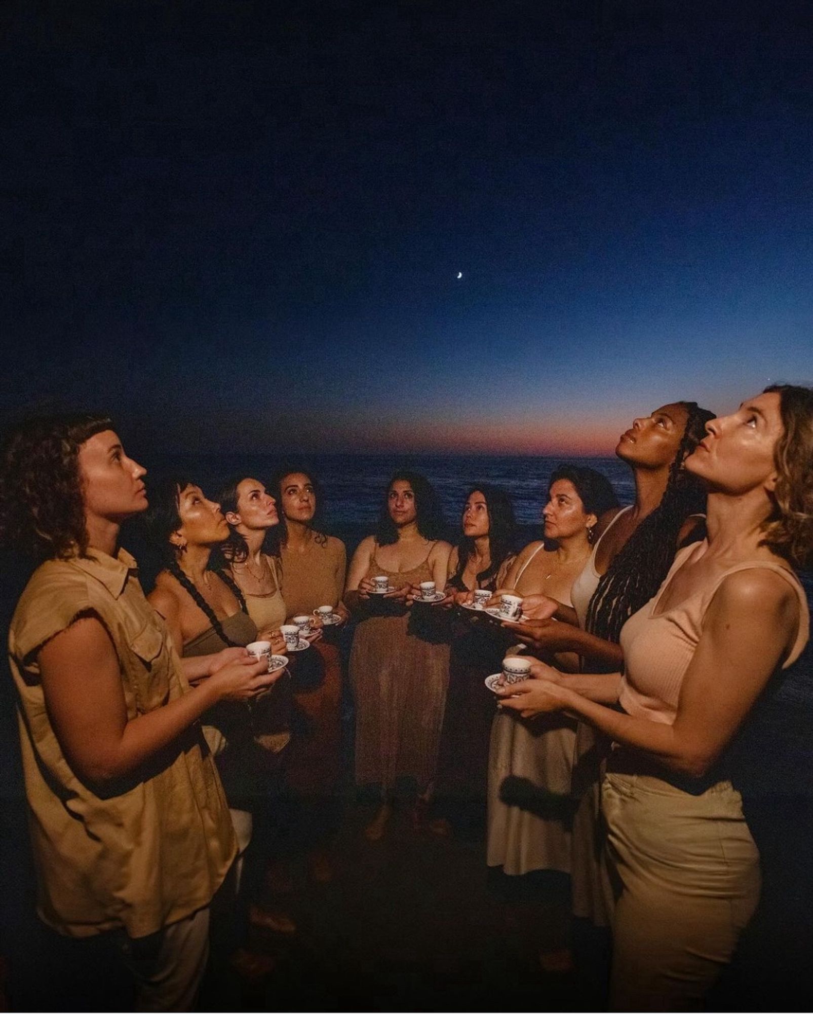 People holding coffee cups to show one ritual that still holds joy for many Palestinians