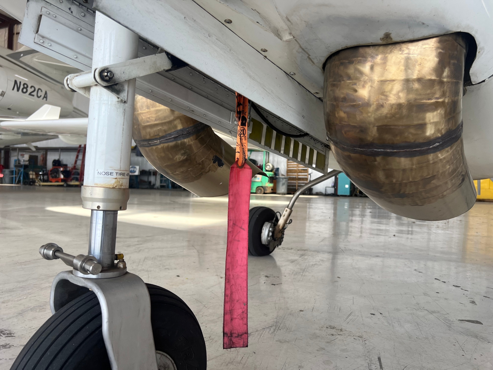 Close up of the twin turbine exhaust stacks that poke either side from the front landing gear retract well