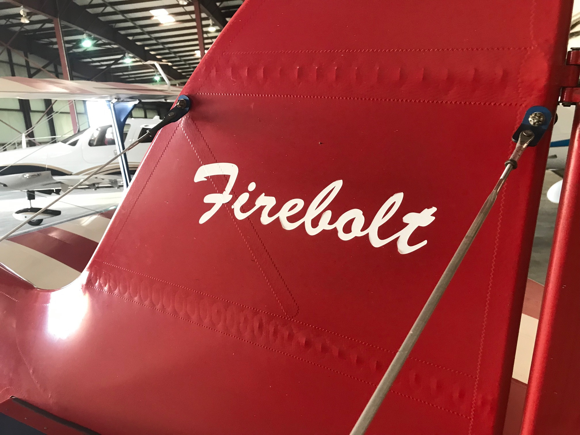 Firebolt is painted in cursive on the tail