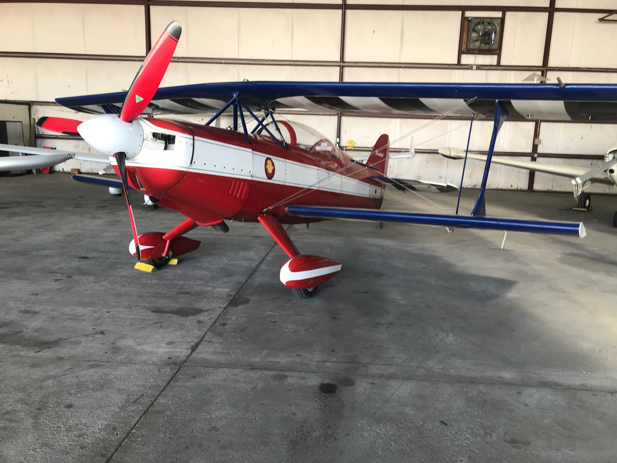 Red white and blue Firebolt, biplane aerobatic aircraft