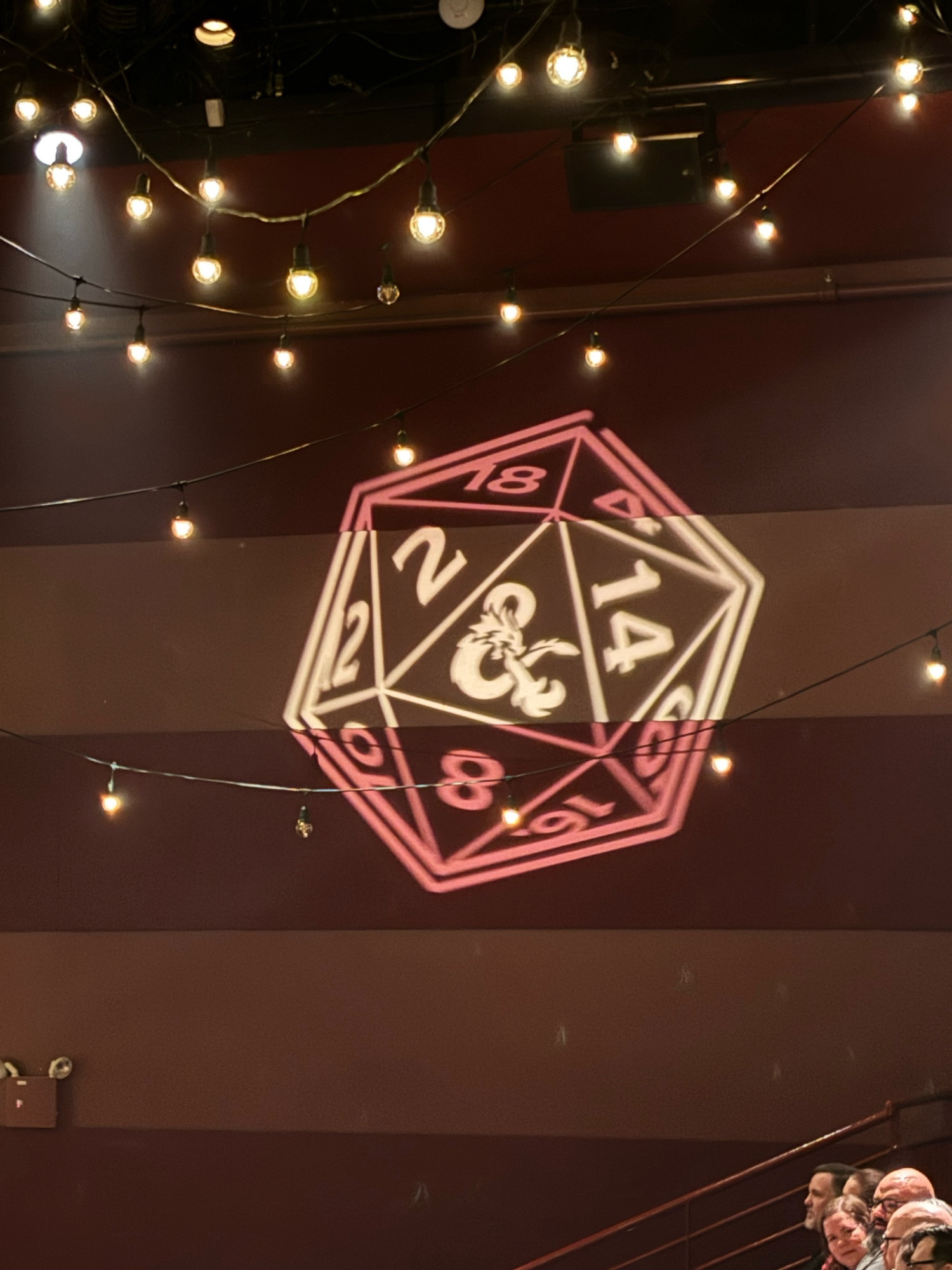 Photo of a projection of a d20 on a wall