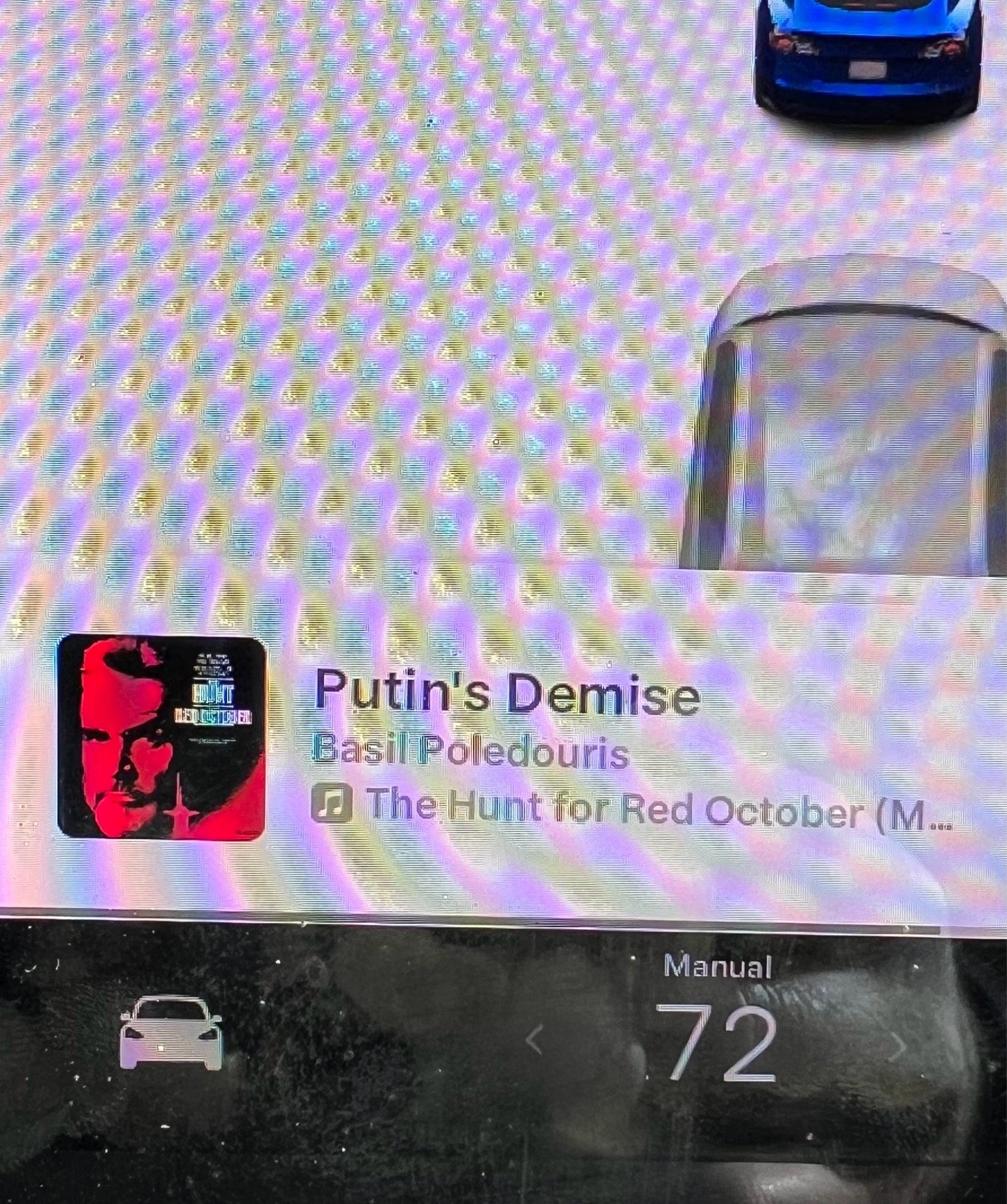 Dashpanel of a Tesla Model 3 playing the track “Putin’s Demise” from the Hunt for Red October soundtrack.