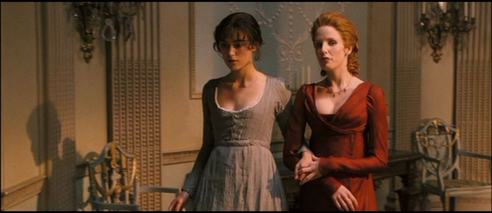 Elizabeth Bennet and Caroline Bingley take a refreshing turn about the room in Pride and Prejudice (2005).