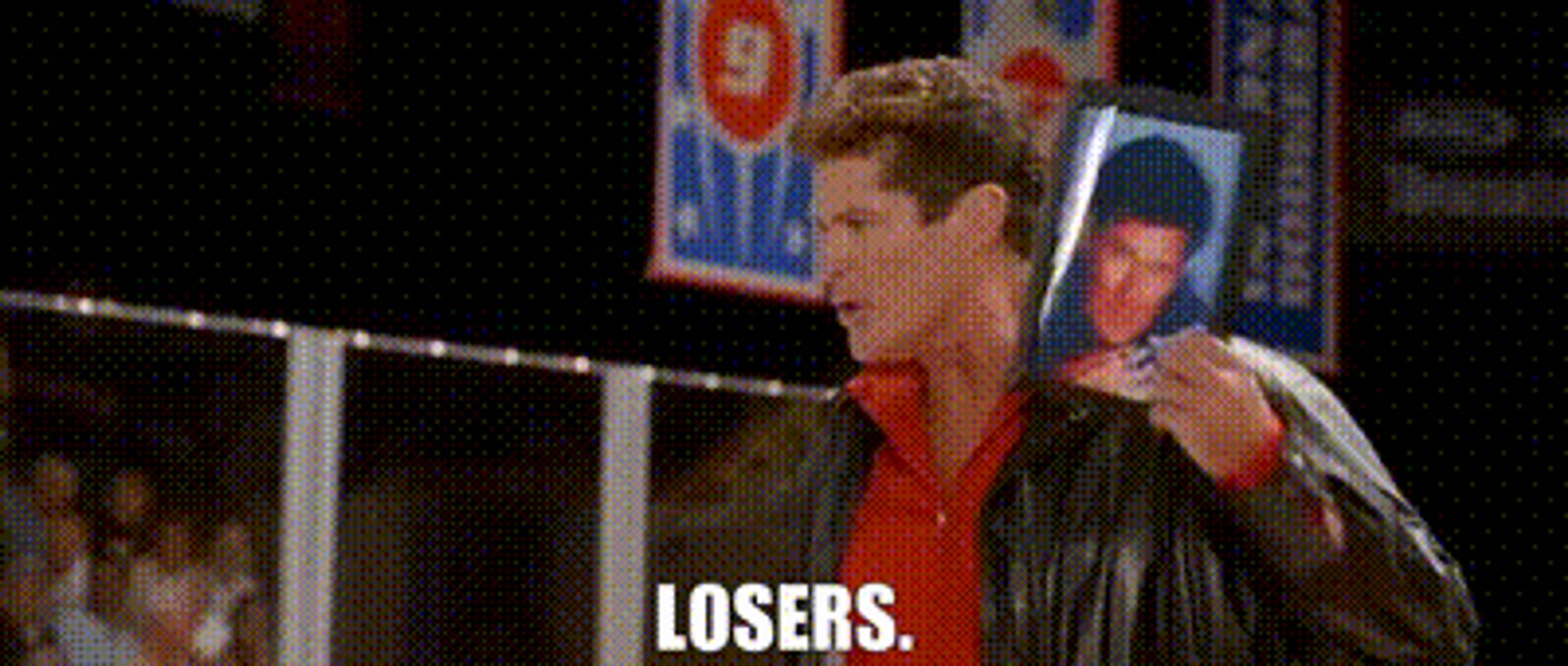 Gif of David Hasselhoff from the 2004 hit movie Dodgeball: A True Underdog Story. In the scene, the German dodgeball team just lost an elimination match. Hasselhoff as their coach, expresses his disgust by yelling "LOSERS!" at the downtrodden team who are sitting on the bench. The Hoff, then holds up a framed picture of himself, before smashing it to the floor breaking the protective glass.