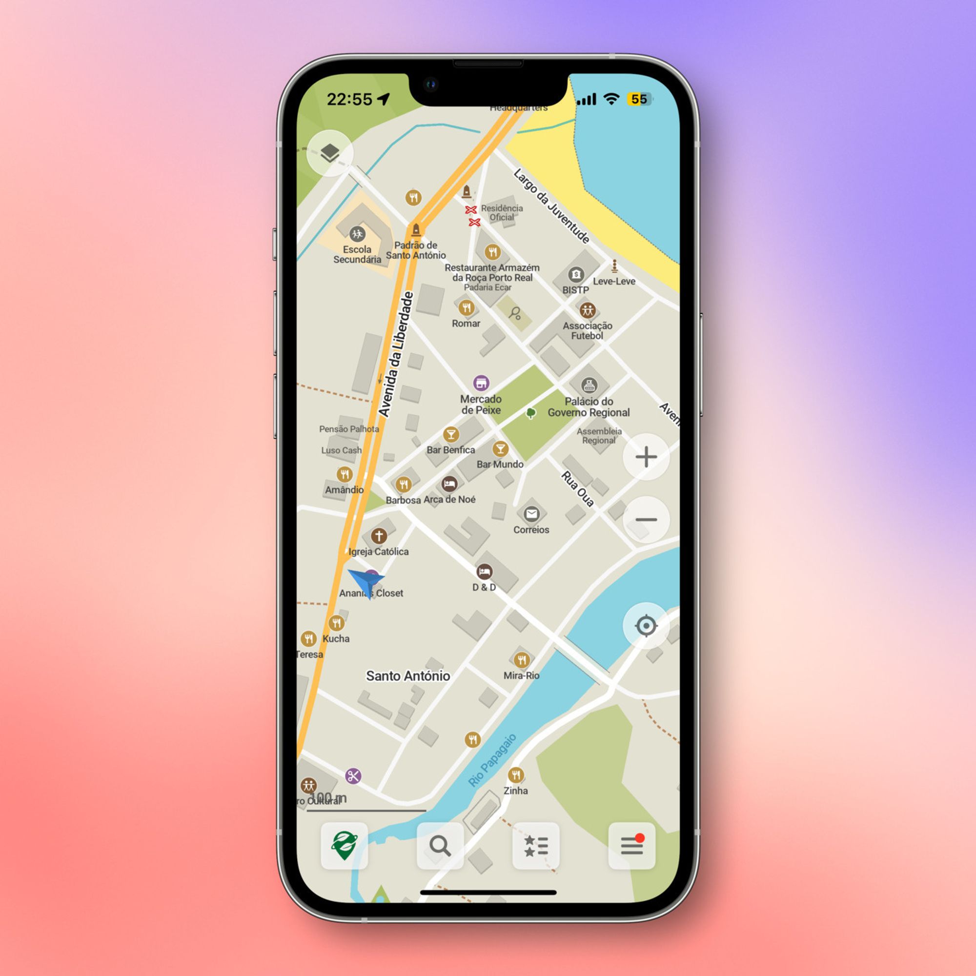 A smartphone screen displays a map of a city area, highlighting streets and landmarks such as restaurants, a school, a church, a market, and government buildings. The phone shows a status bar at the top with the time and signal indicators. The background