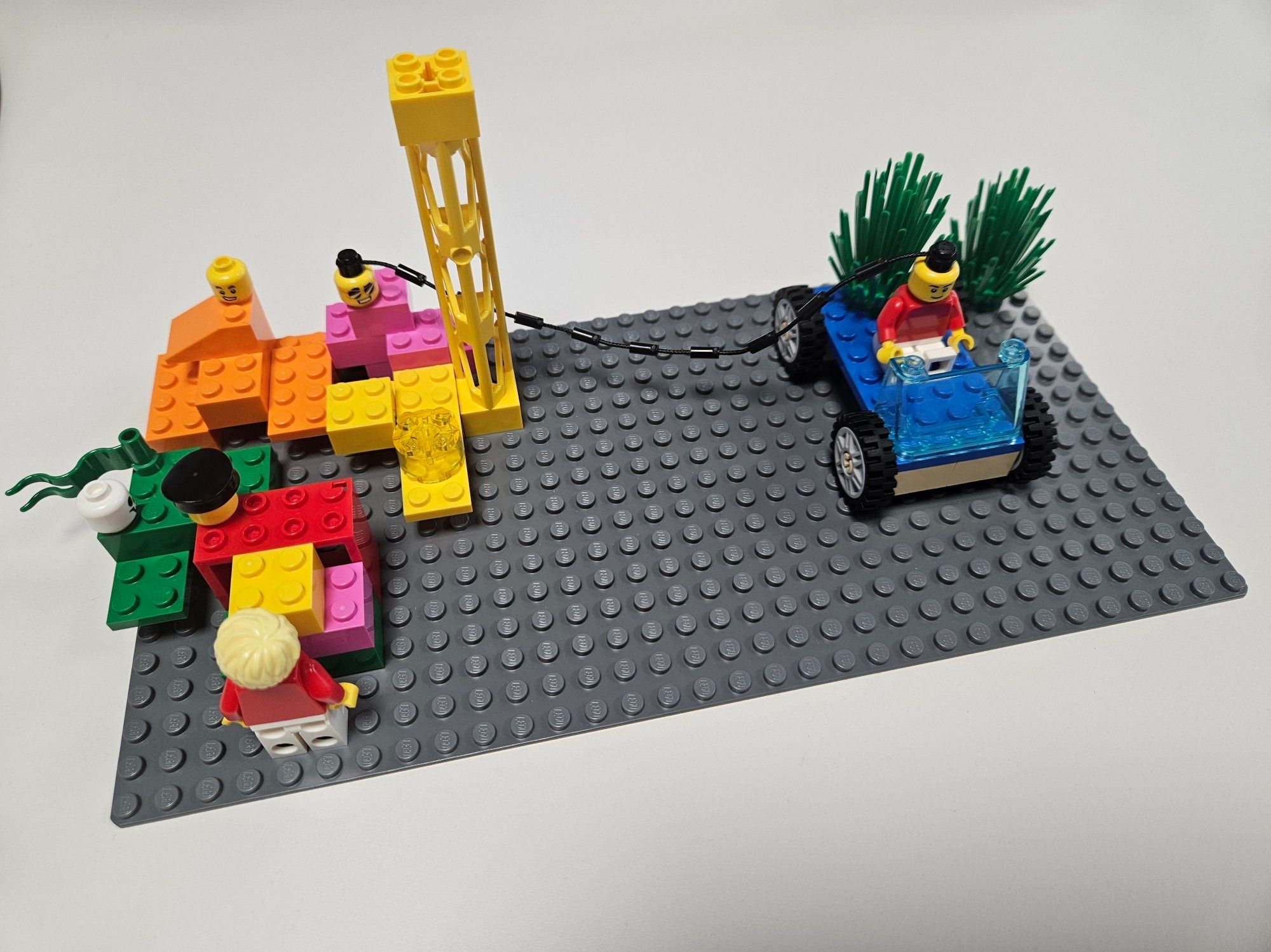 Lego model as a metaphor for shared knowledge and continuous improvement.