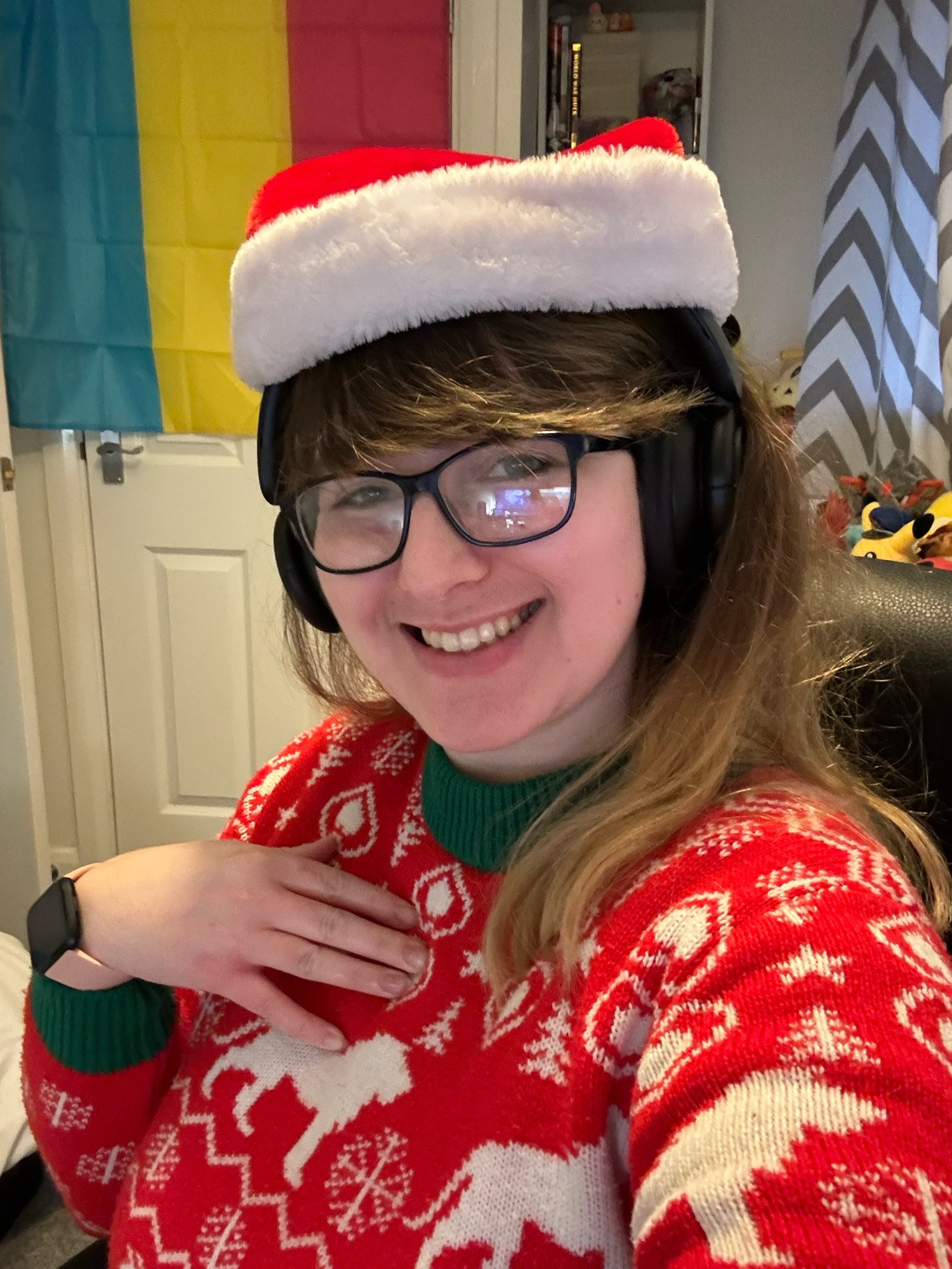 Me in a Christmas hat and jumper smiling