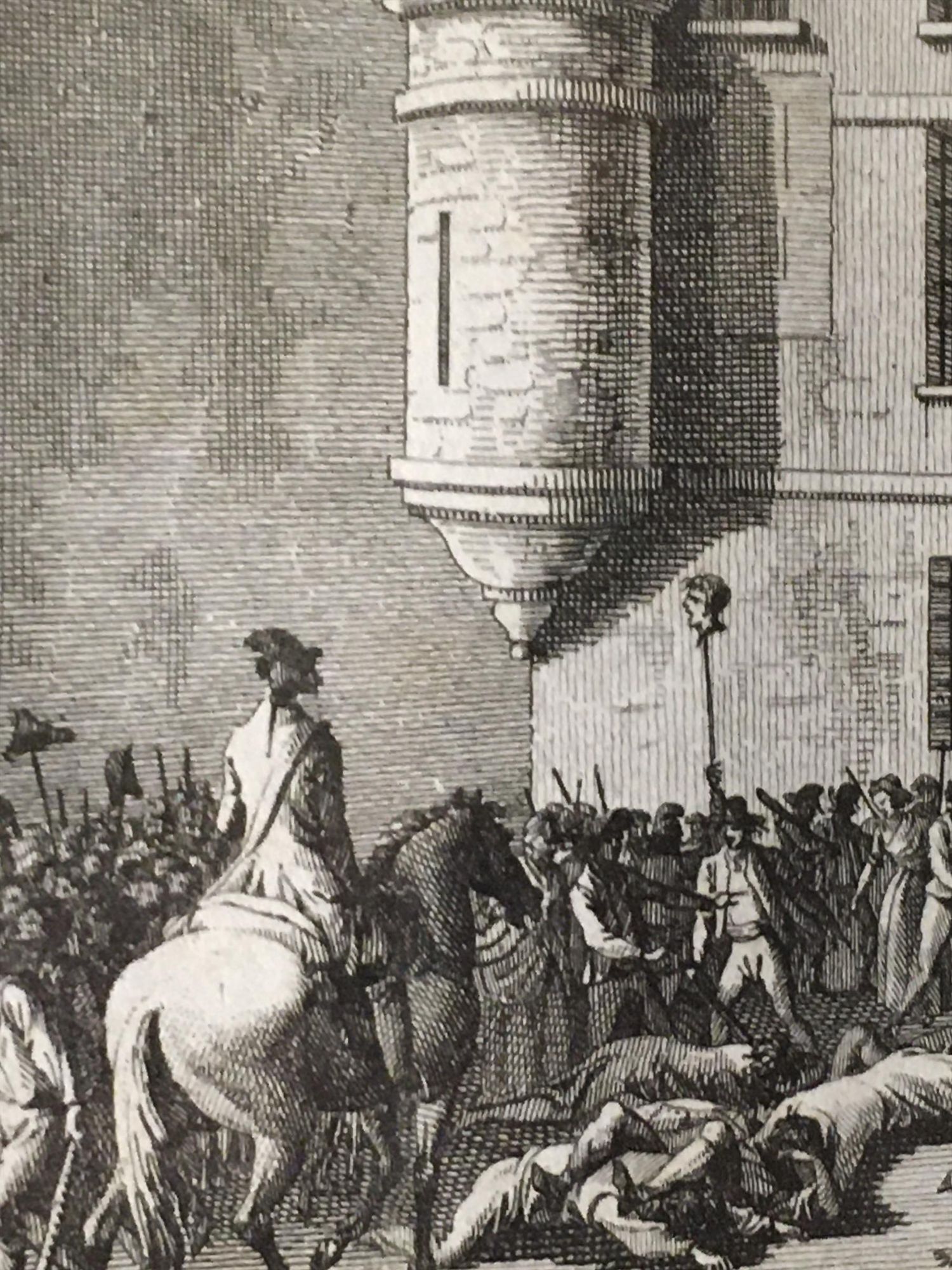 detail of the preceding:

a man on horseback faces the crowd beneath the building; a severed head on a pike is held aloft