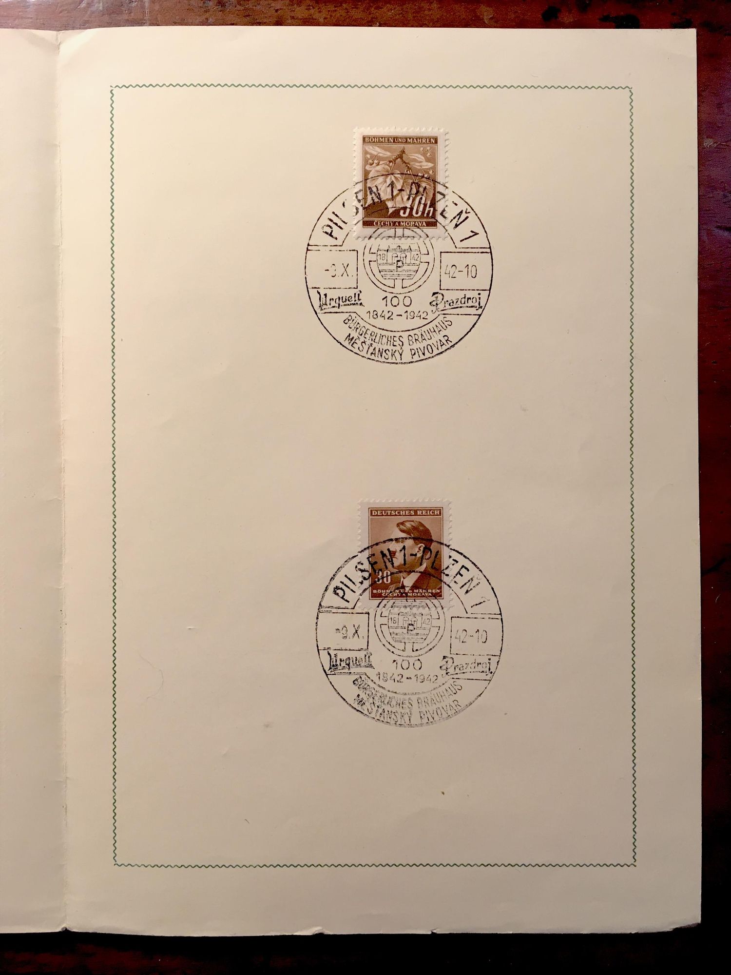 inside of souvenir booklet:

two stamps with special cancellations commemorating the brewery centennial.

Both are brown:

top: the 30h stamp with the national symbol of the linden leaf 
bottom: the 30h Hitler stamp (head facing left)