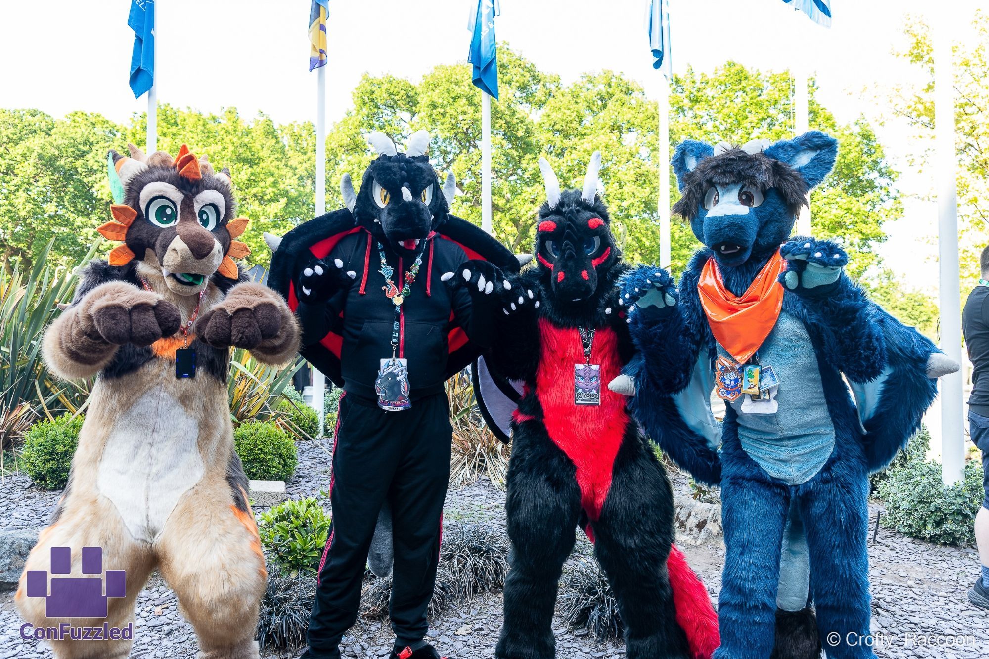 Four dragons pose by some flags at CFz2023