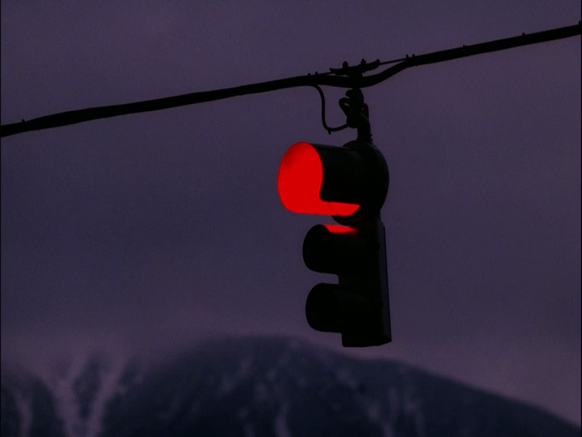 A red traffic light at dusk. Twin Peaks S02E04 - Laura's Secret Diary.