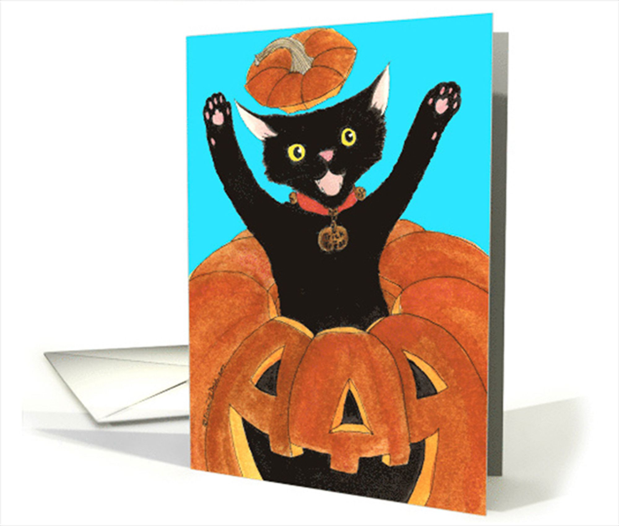 The front of a greeting card featuring my ink and watercolor illustration of black kitten popping out of a jack o' Lantern, carved pumpkin against a peacock blue background.