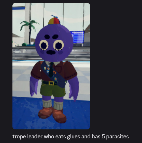 my peak character show, purple with wide eyes and bottom lashes and round eyebrows, they are wearing the scoutmaster outfit with propeller hat
text says "trope leader who eats glues and has 5 parasites"
misspelled troop as trope