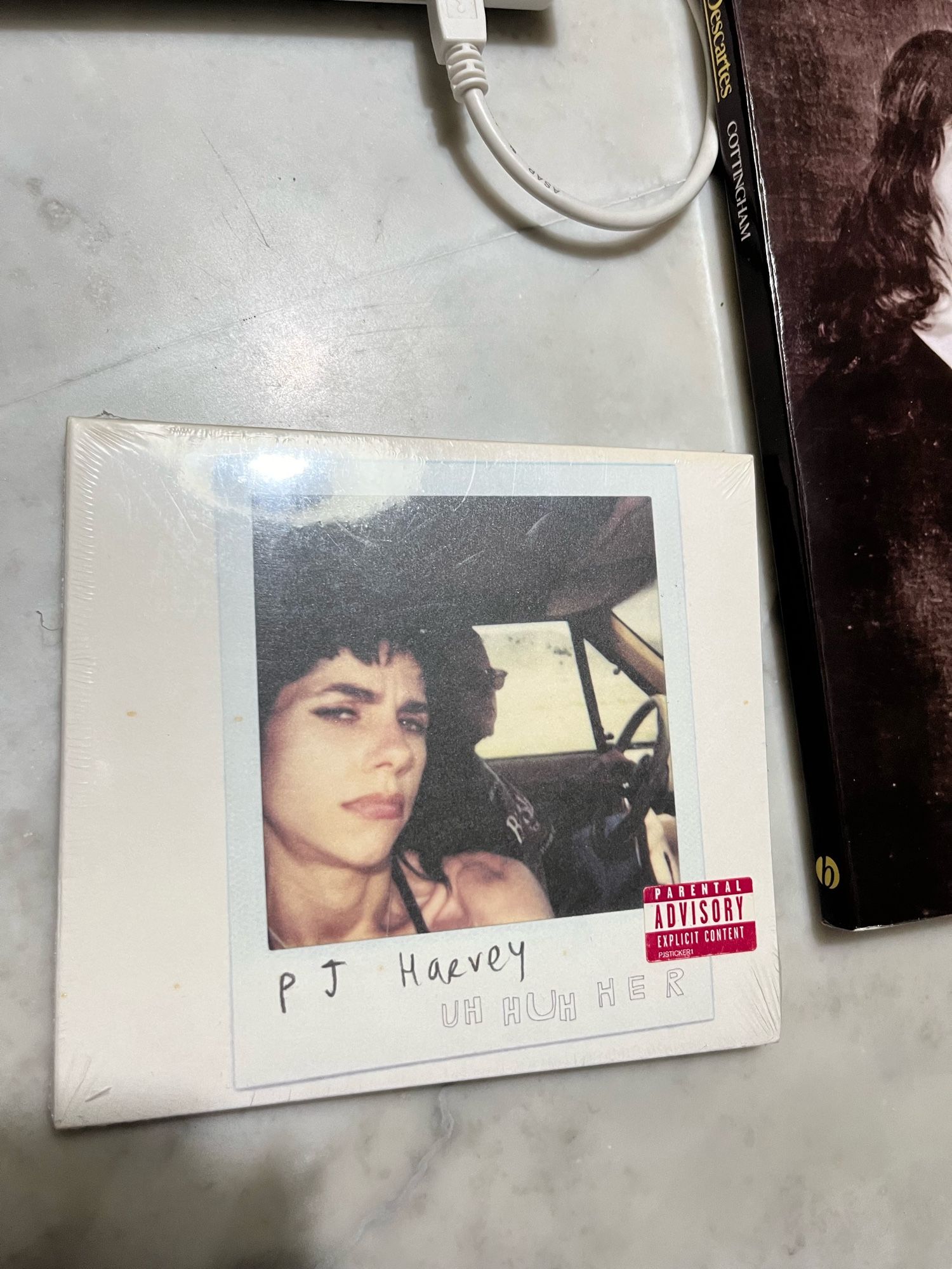 A copy of PJ Harvey’s Uh Huh Her