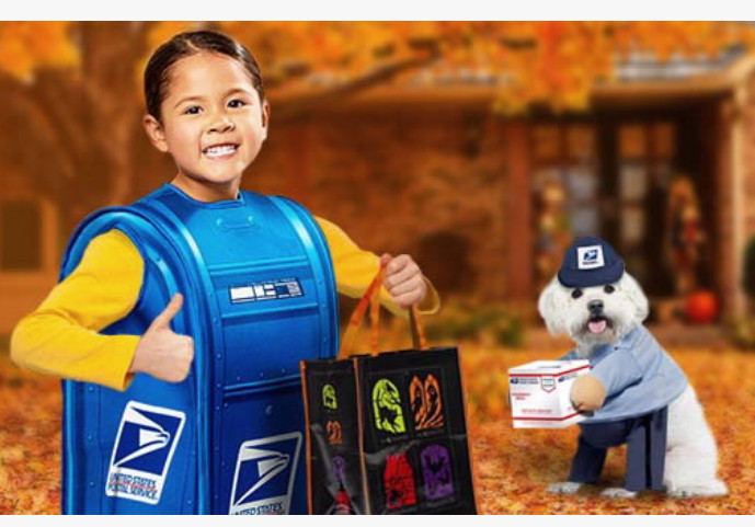 Picture of kid in a post box costume next to a dog in a mail deliverer's costume.